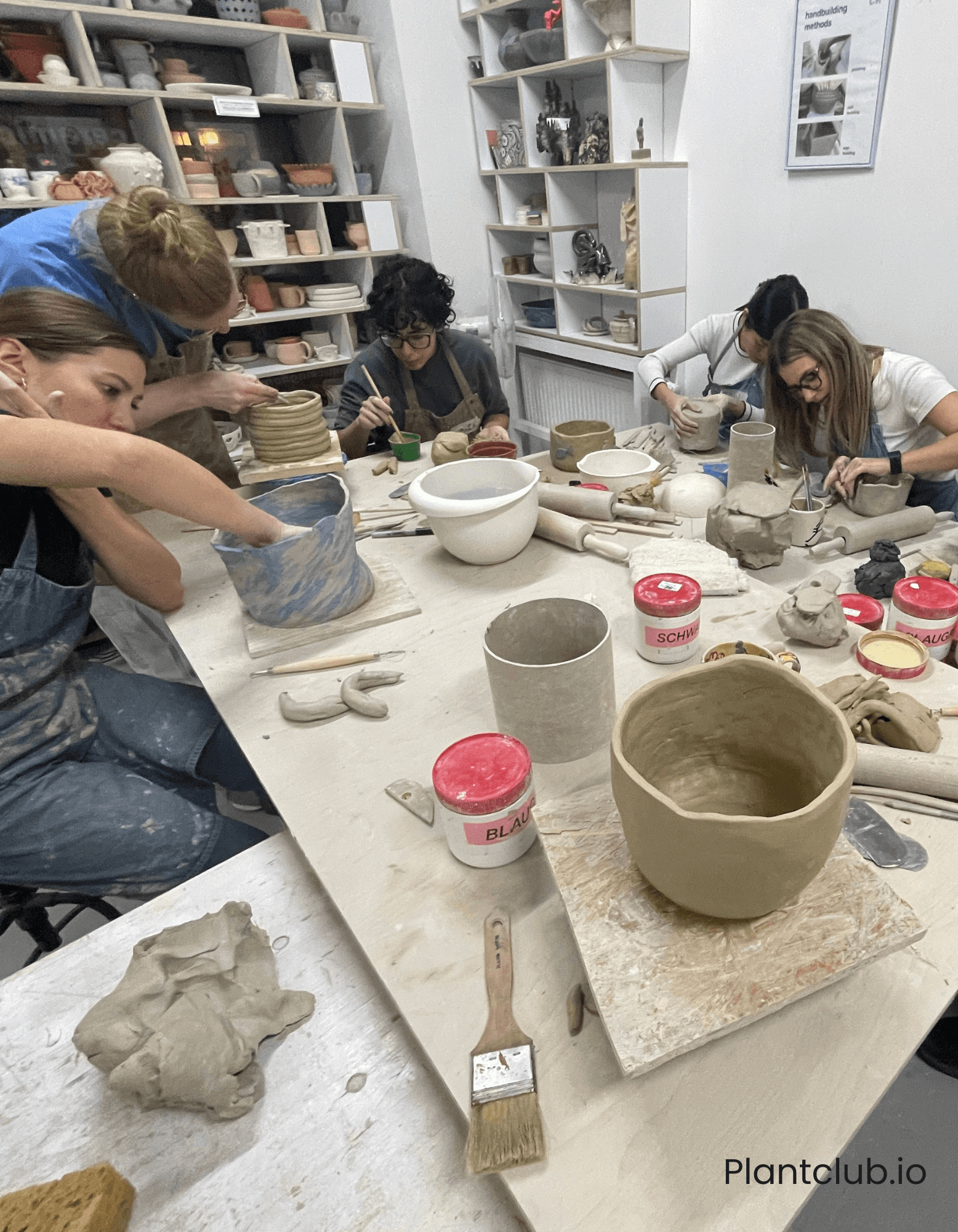  Workshop participants shaping their ceramics. 
