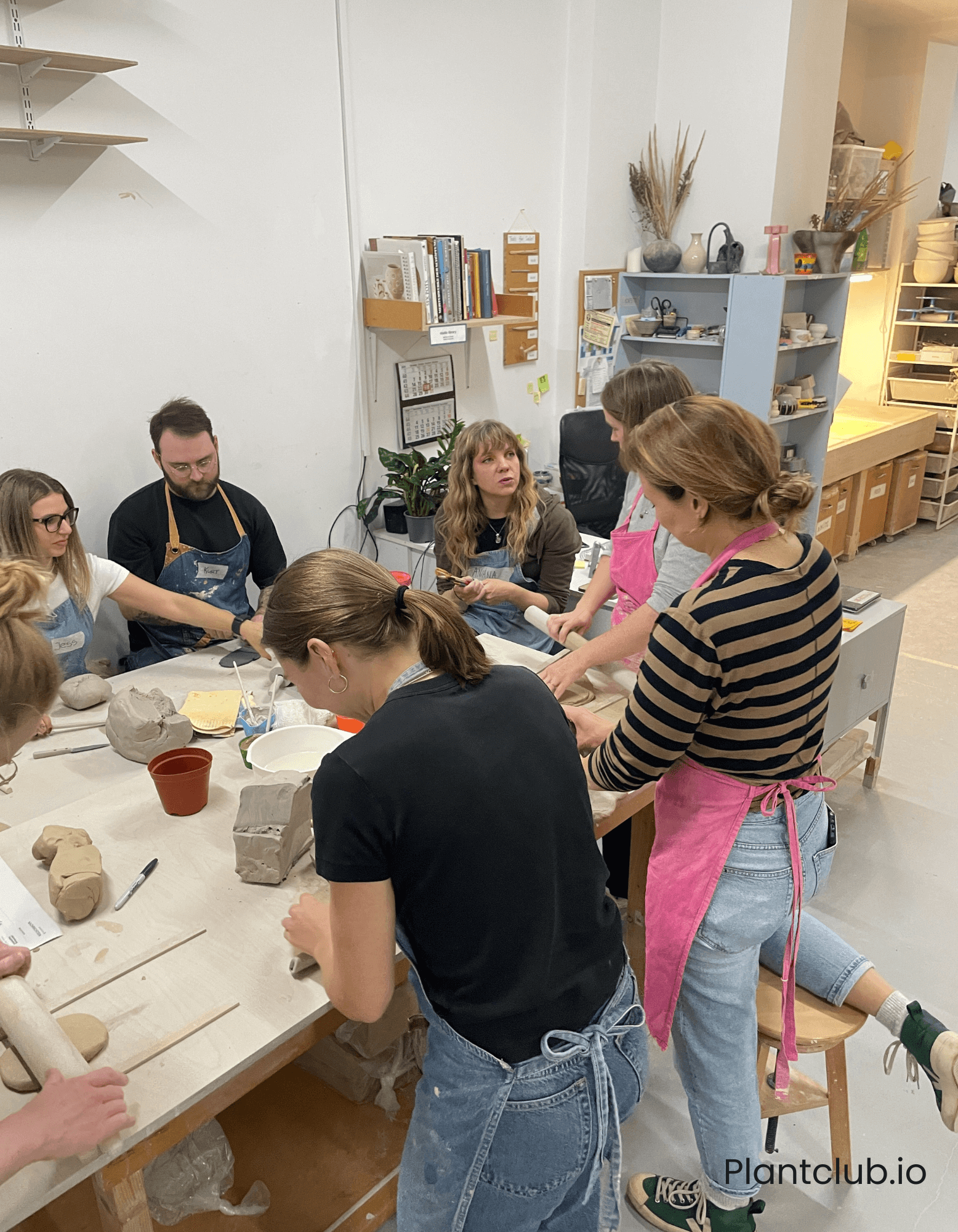 Group of people hand-building a planter