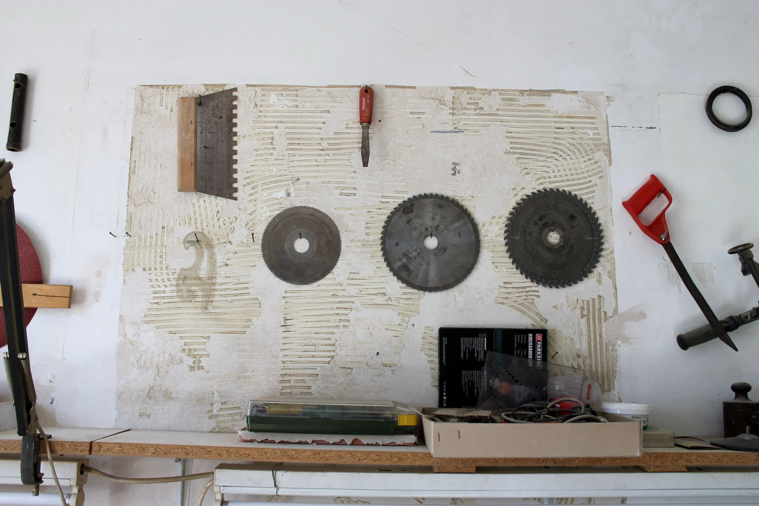 João does a lot of the construction of designs in his work room. 
