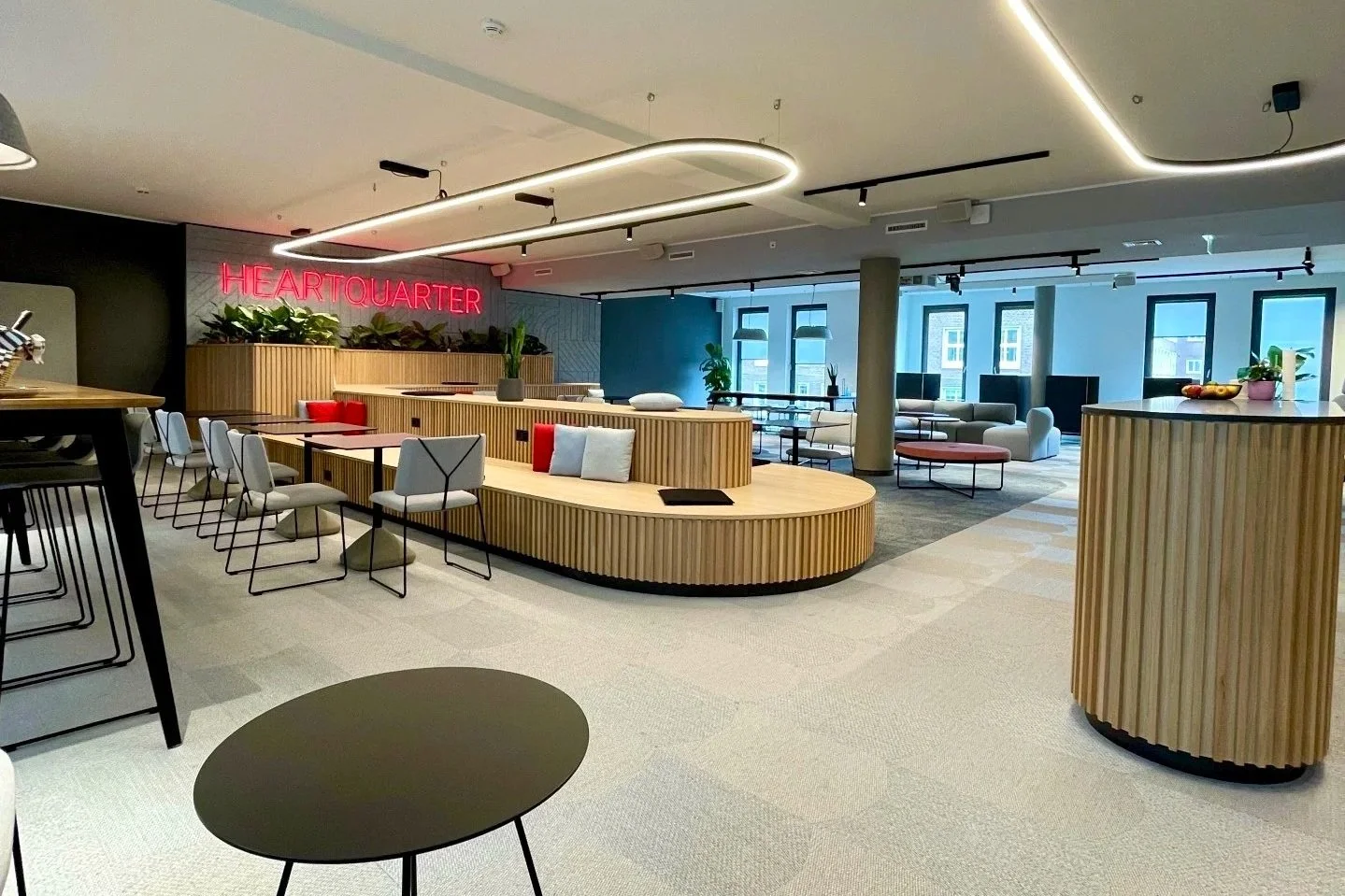  Office with built in planters structuring collaboration areas 