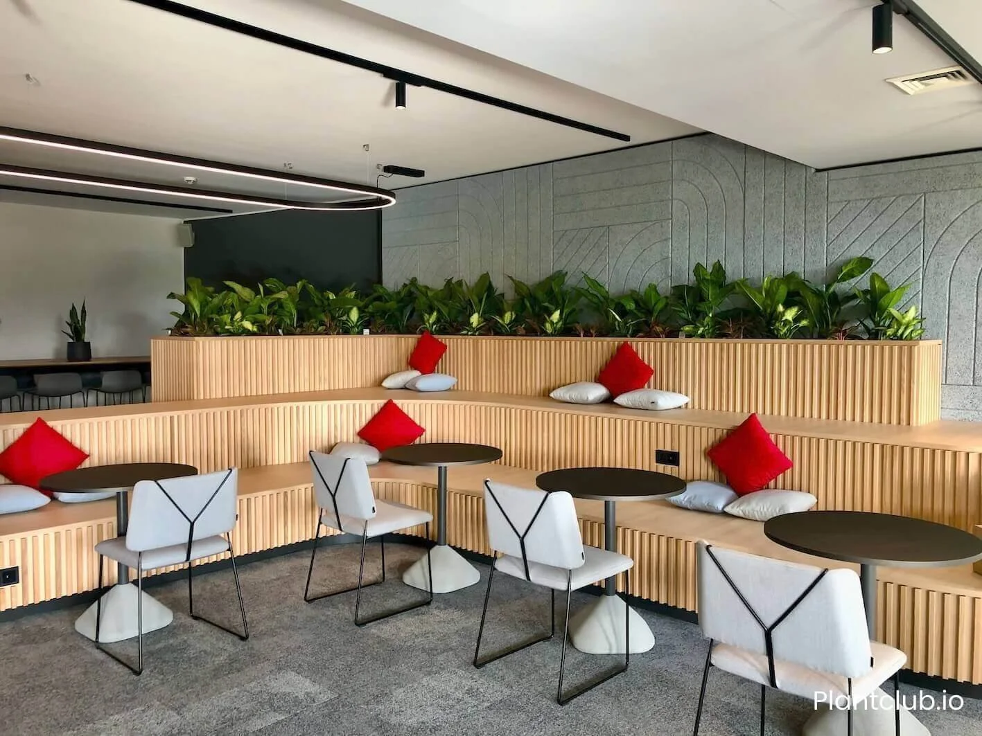  ParshipMeet Group's  common area featuring a long planter&nbsp;brimming with lush greenery.&nbsp; 