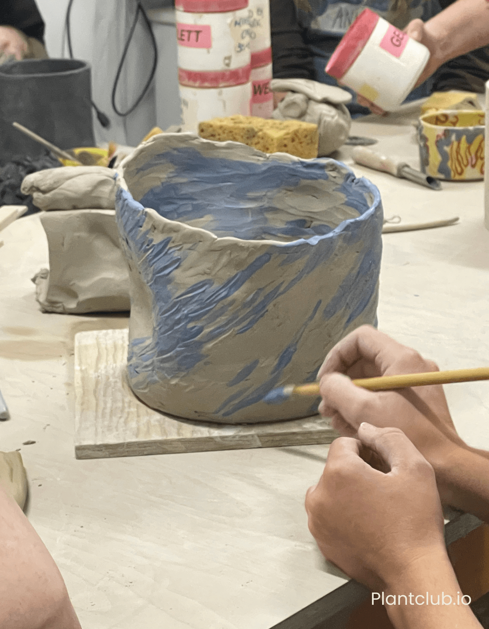  Putting the finishing touches a pot. 