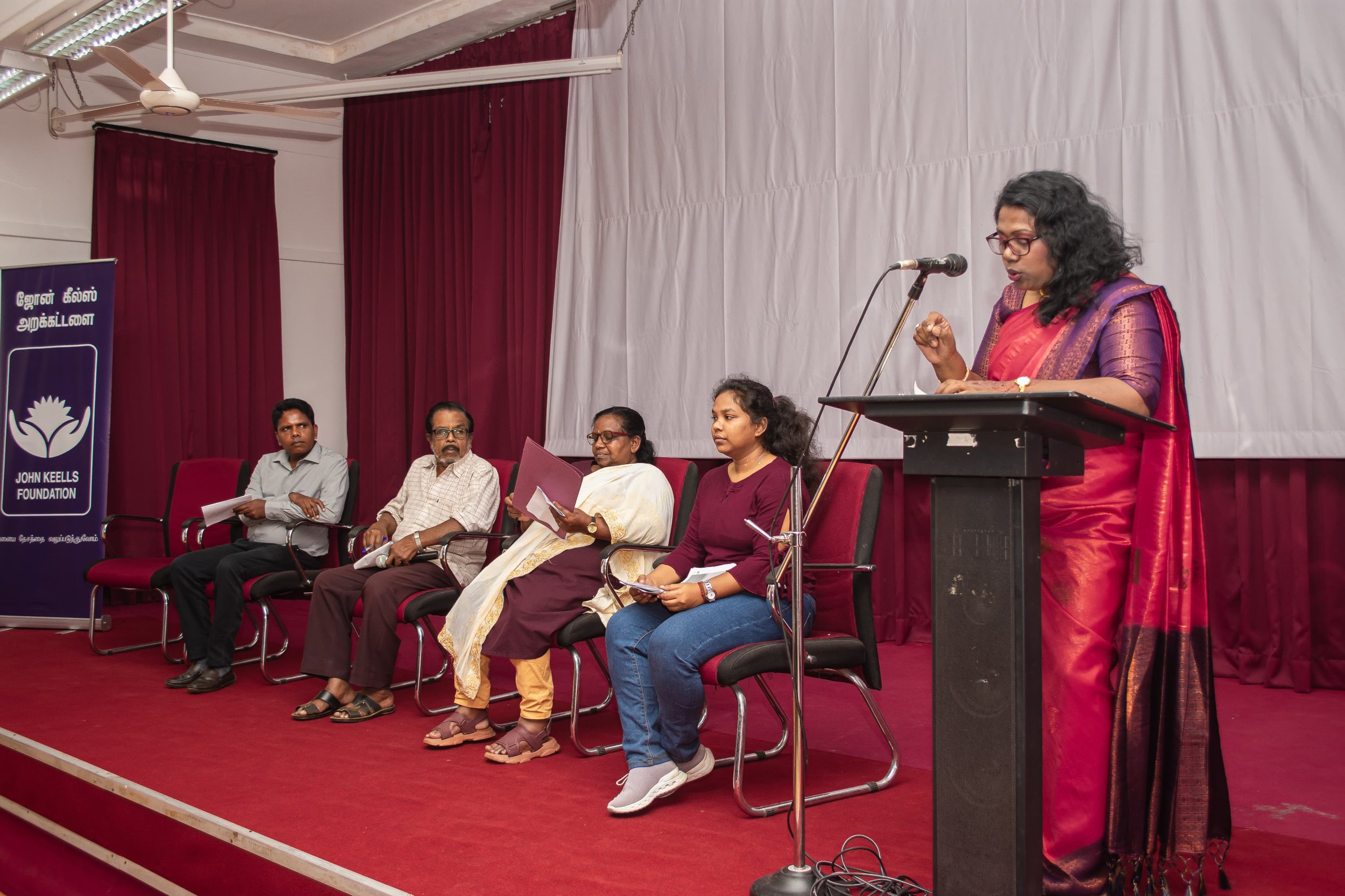 Writer Esther is reading from her poetry during the first session when writers from Malaiyaham read from their work.jpg