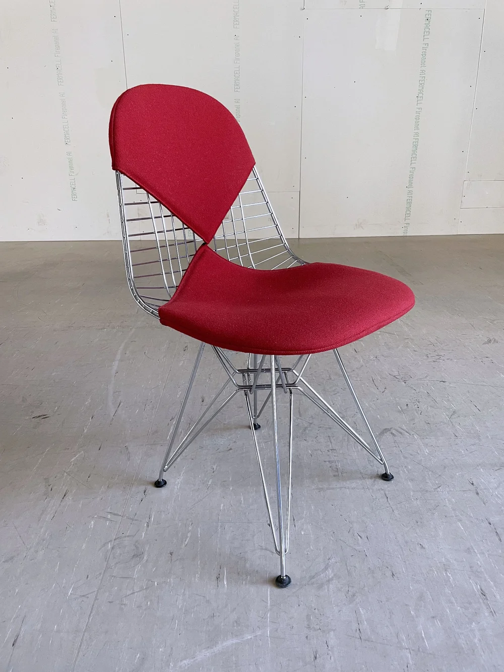 Vitra Eames DKR Wire Chair with red hopsack Designed by