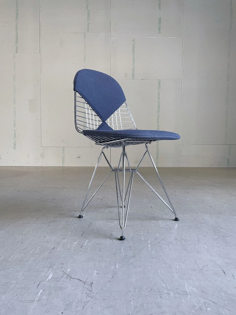 Vitra Eames DKR Wire Chair with blue hopsack Designed by