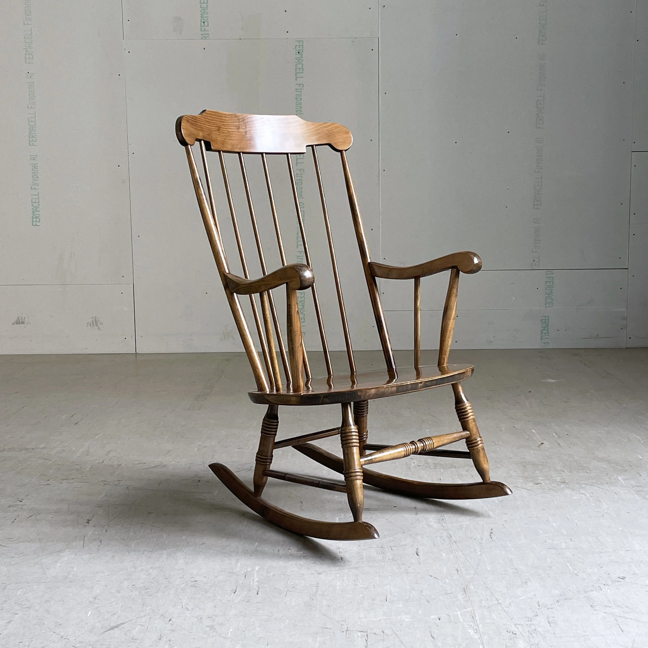 Mid century high backed rocking chair