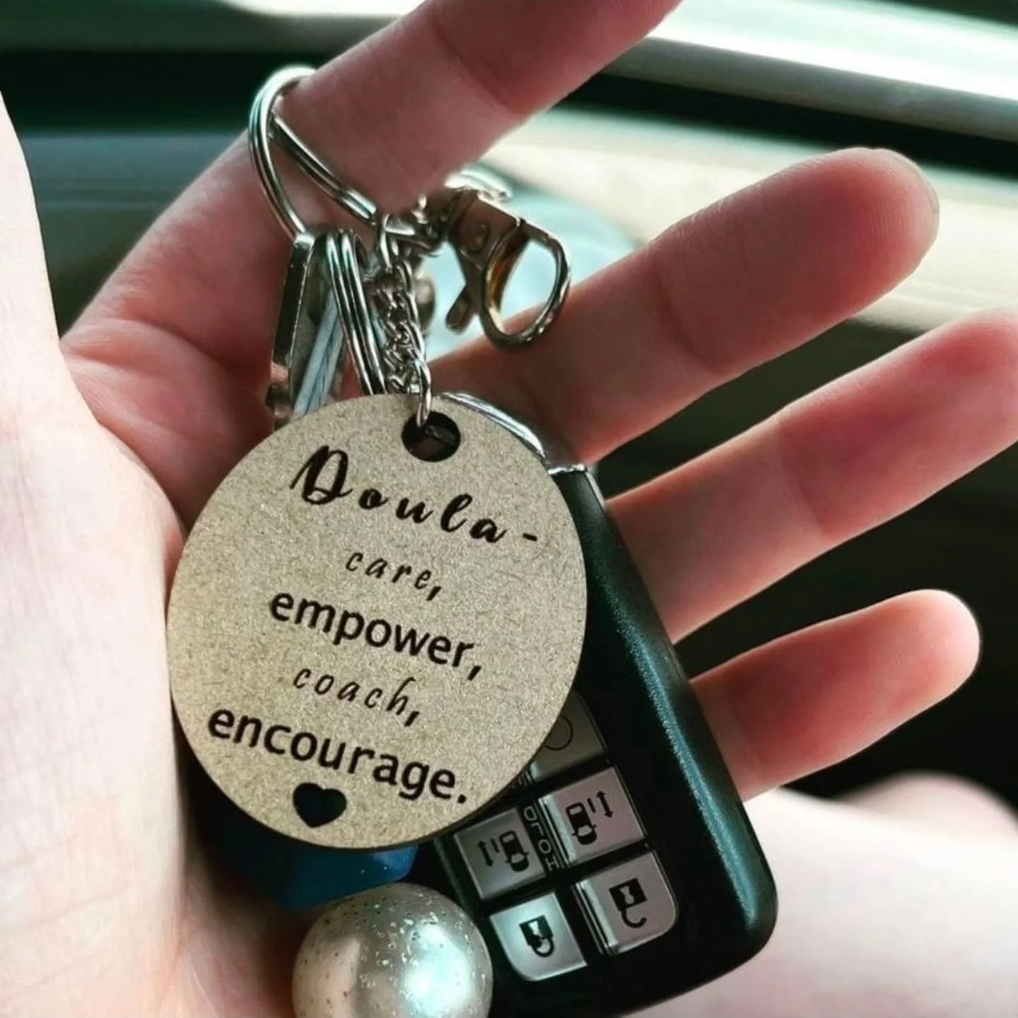This is doula Caty's keychain!

What you really need of your doula is unwavering faith in you and your abilities, however you carry, birth and care for your baby.

Doulas:
▪️Are a barometer of normal
▪️Slow the room when it seems it's spinning
▪️Are 