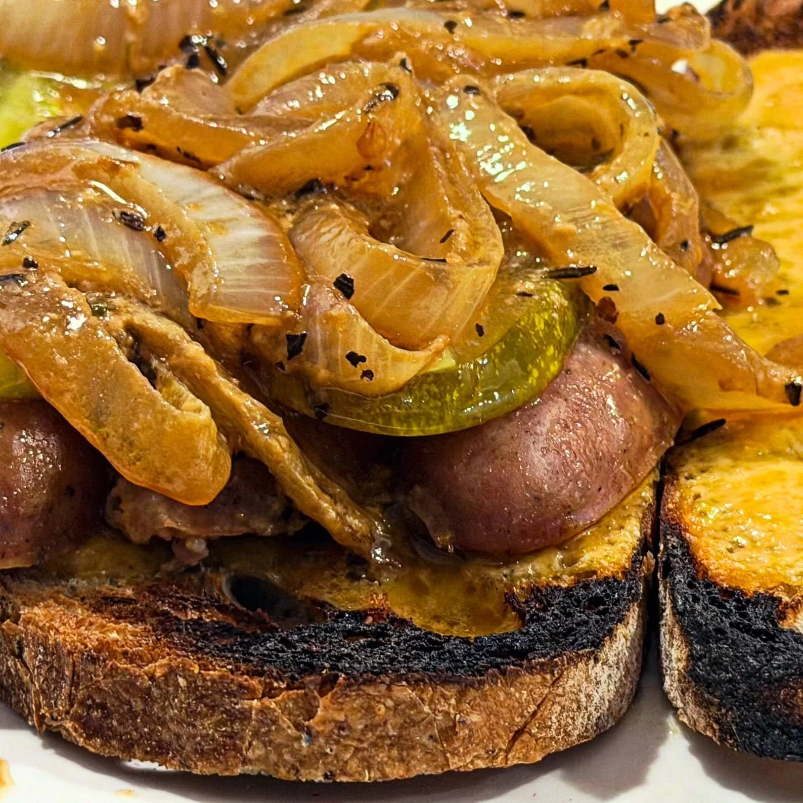Crew house LOVE SANDWICHES. Bratwurst with saut&eacute;ed onions in mustard on olive loaf breast with melted cheddar. #filmset #foodie #ilwp #lovesandwich