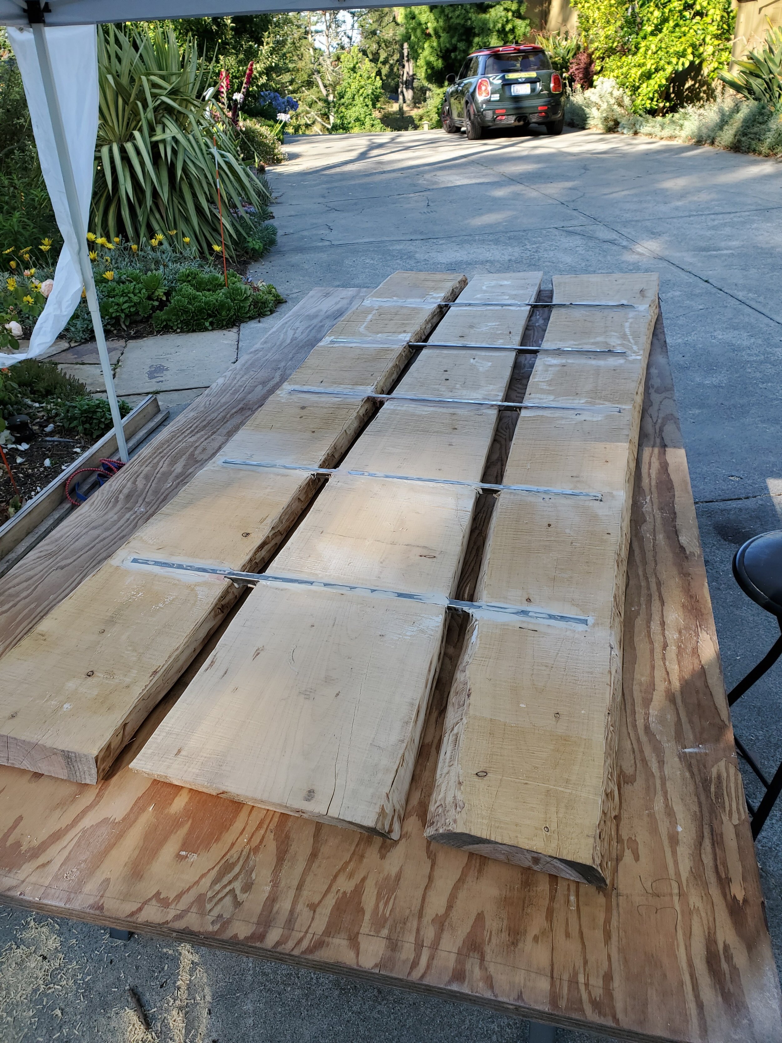 I use 3/4 inch square tubing routered in and bonded to give structural stability to the table
