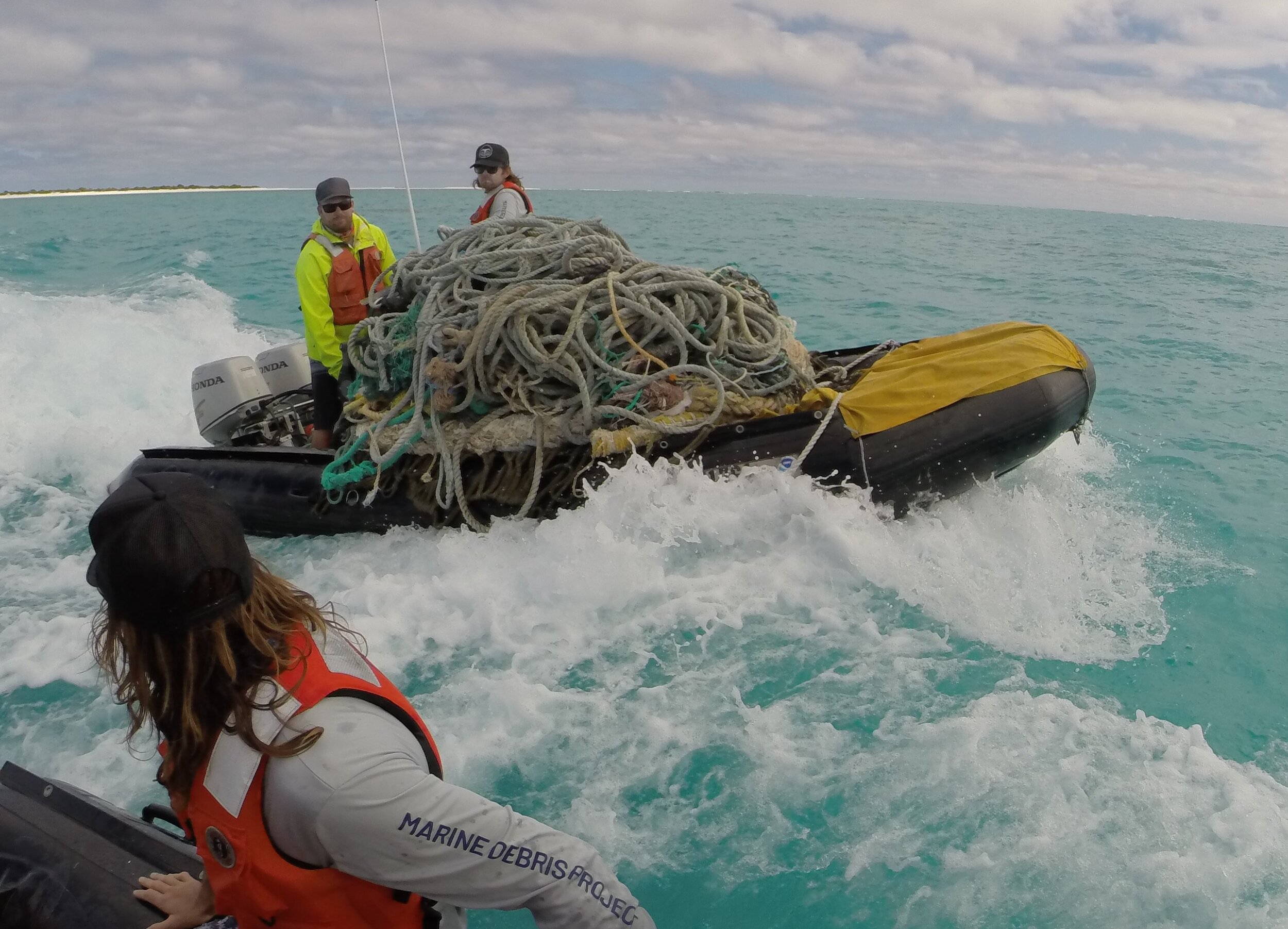 10. Kevin O'Brien of PMDP and Tate Wester of ESD NOAA Transiting with Ghost Nets at Holaniku Photo By Matt Saunter PMDP (1).jpg