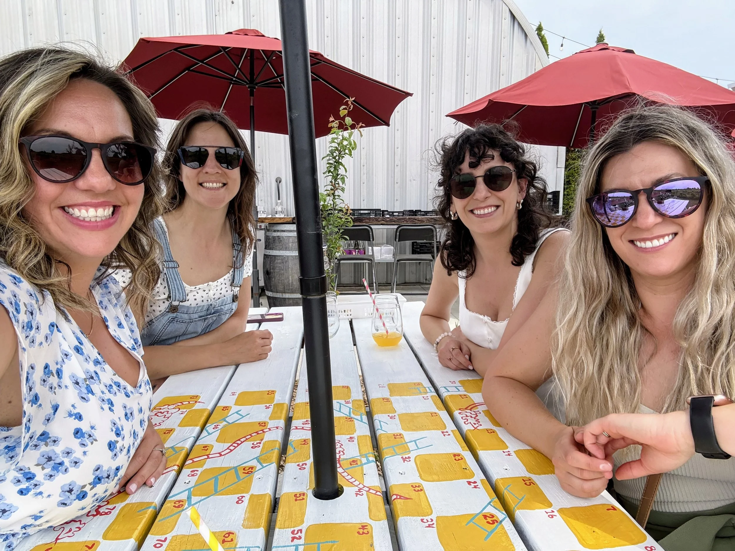 Having the best time at Traynor Family Vineyards. This winery has all the colourful things: from playful labels to a bountiful patio to best enjoy the summer sunshine.