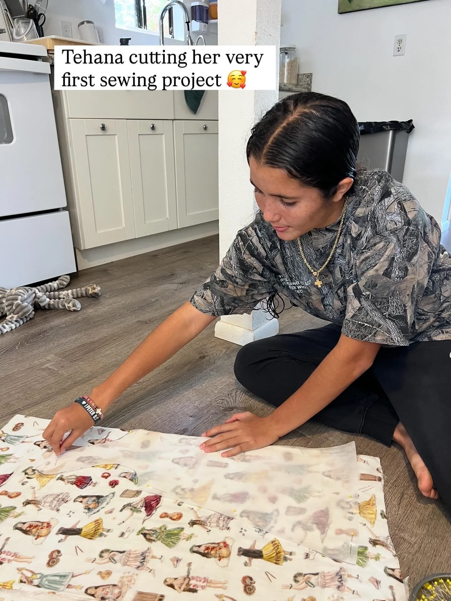 Tehana cutting hula fabric.jpg