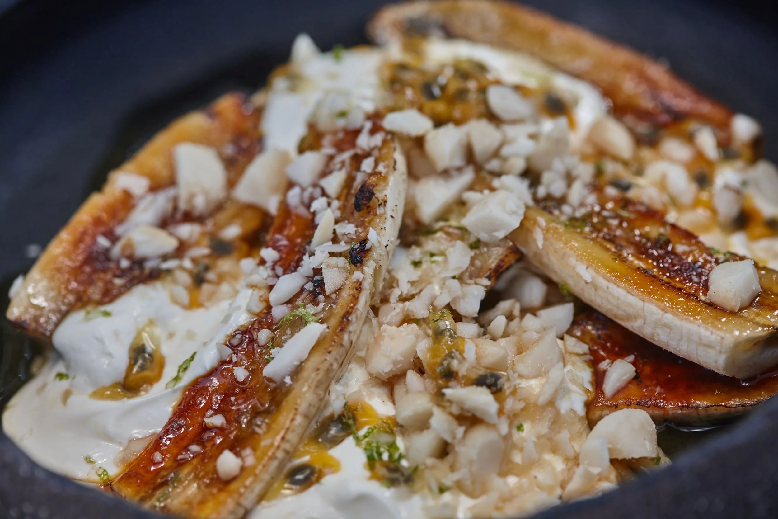 Brûlèed Bananas with creme fraiche, passionfruit, lime and macadamias