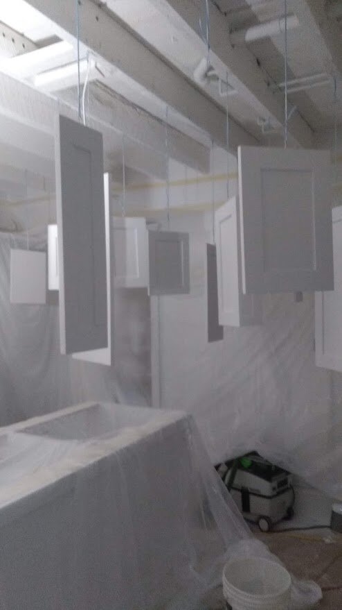 Spraying the cabinet doors and ceiling