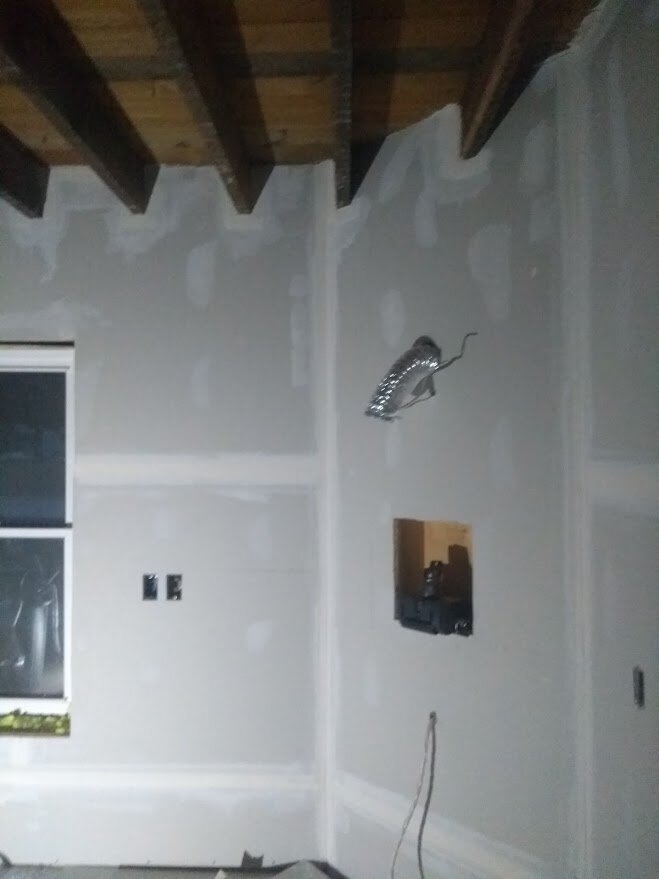 Drywall, flat taped around every joist