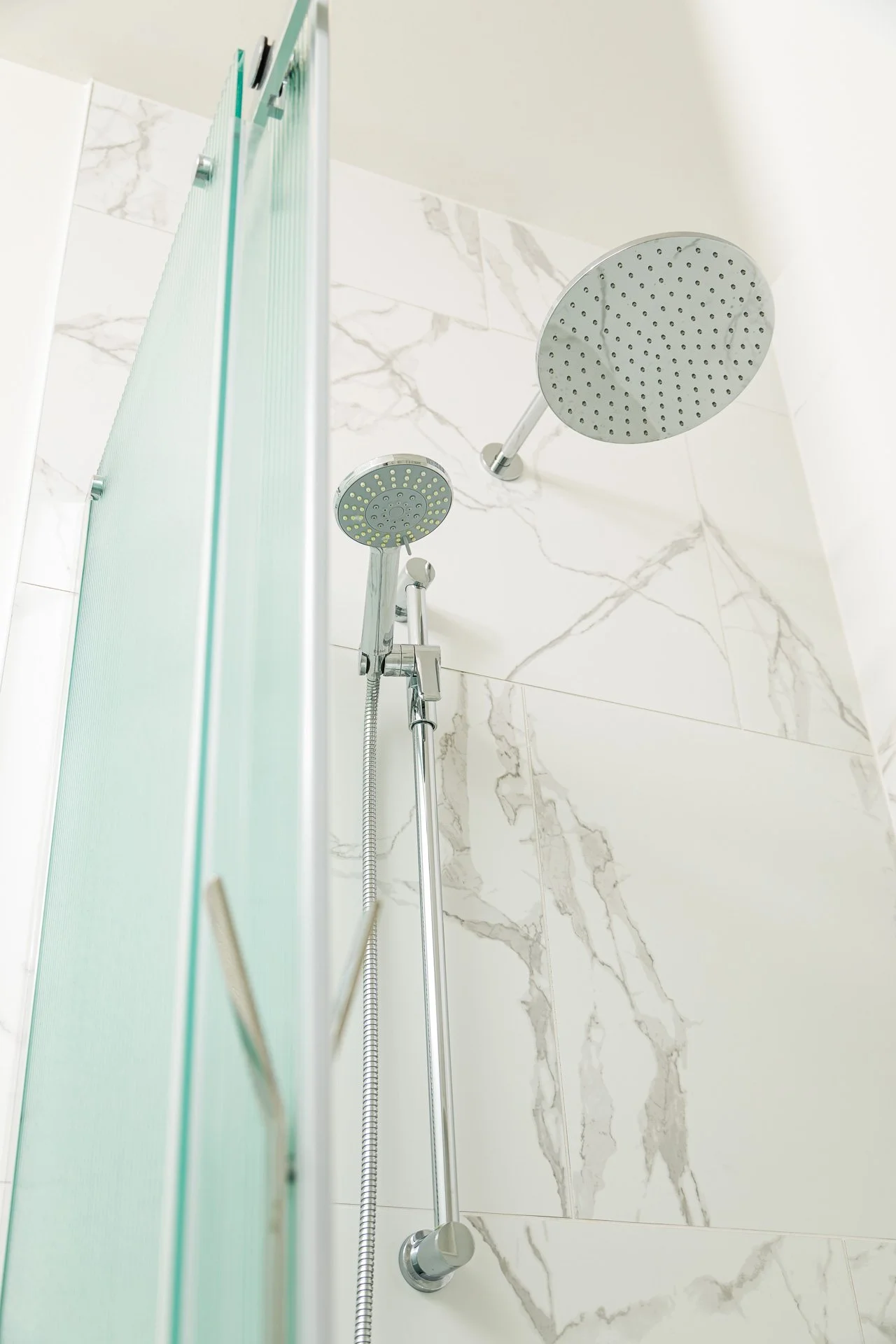 Collingwood primary master bathroom chrome fixtures walk-in.jpg