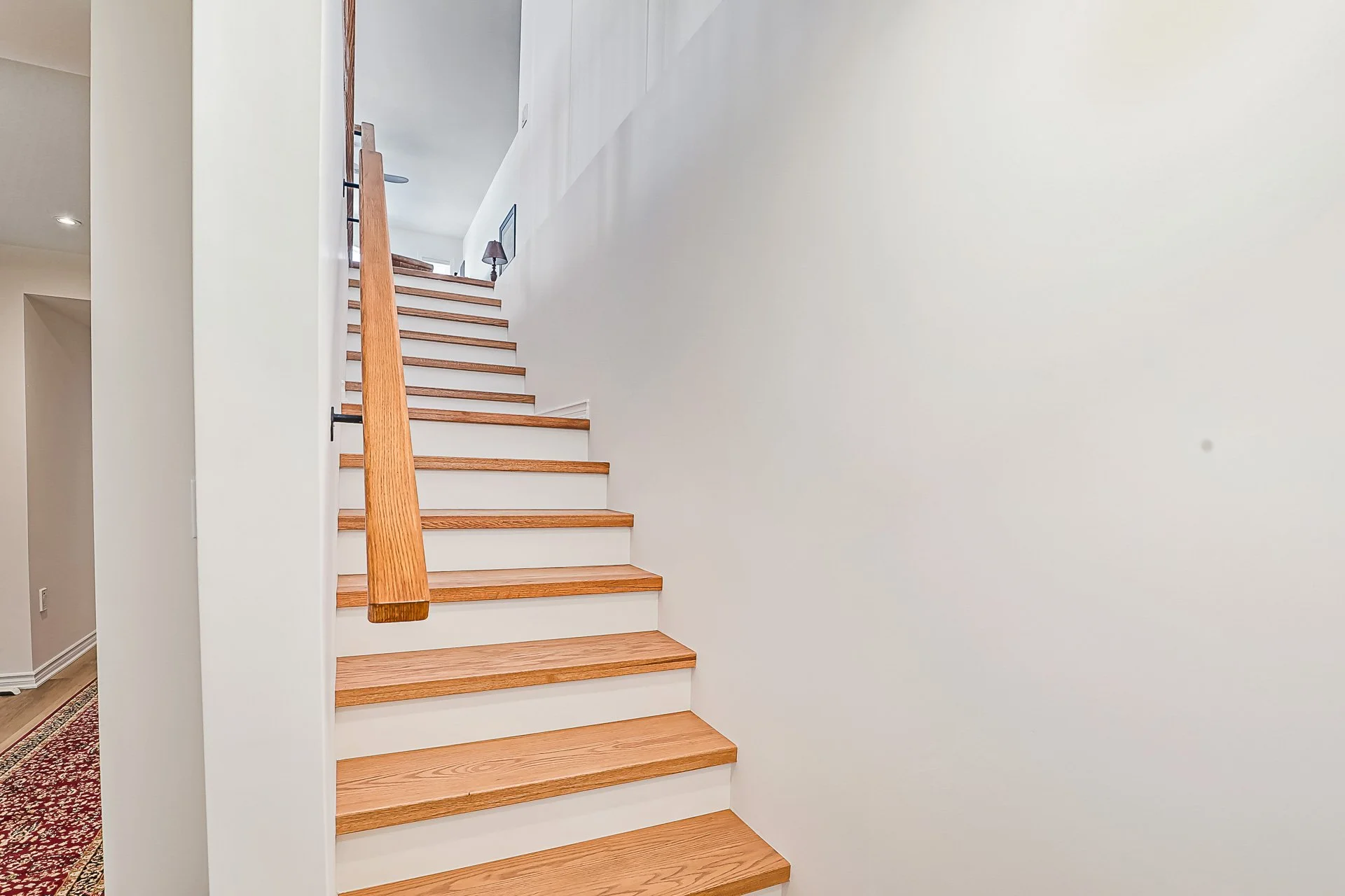Collingwood custom stair landing, hardwood.jpg