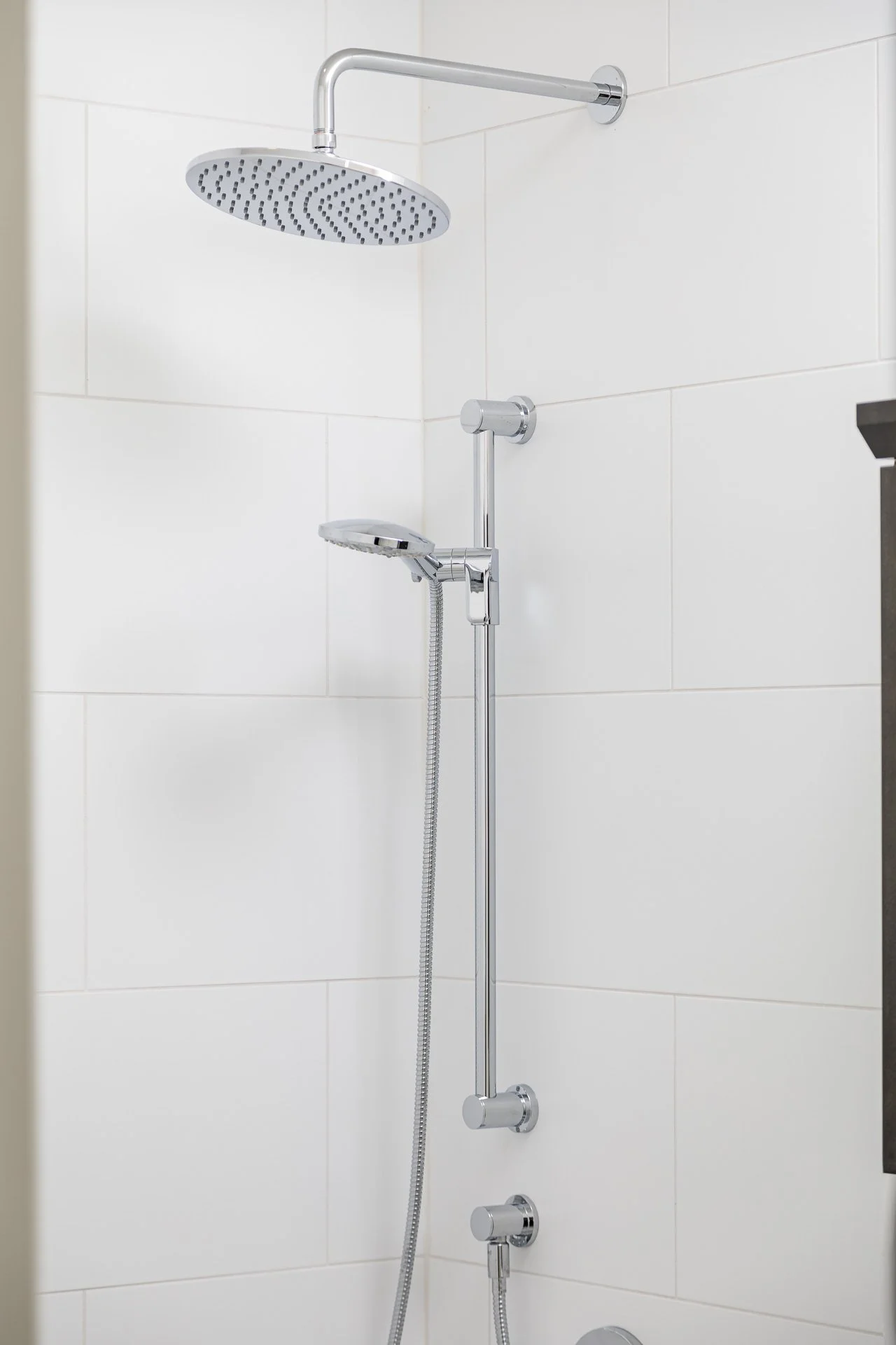 Collingwood white tile shower, chrome fixtures.jpg