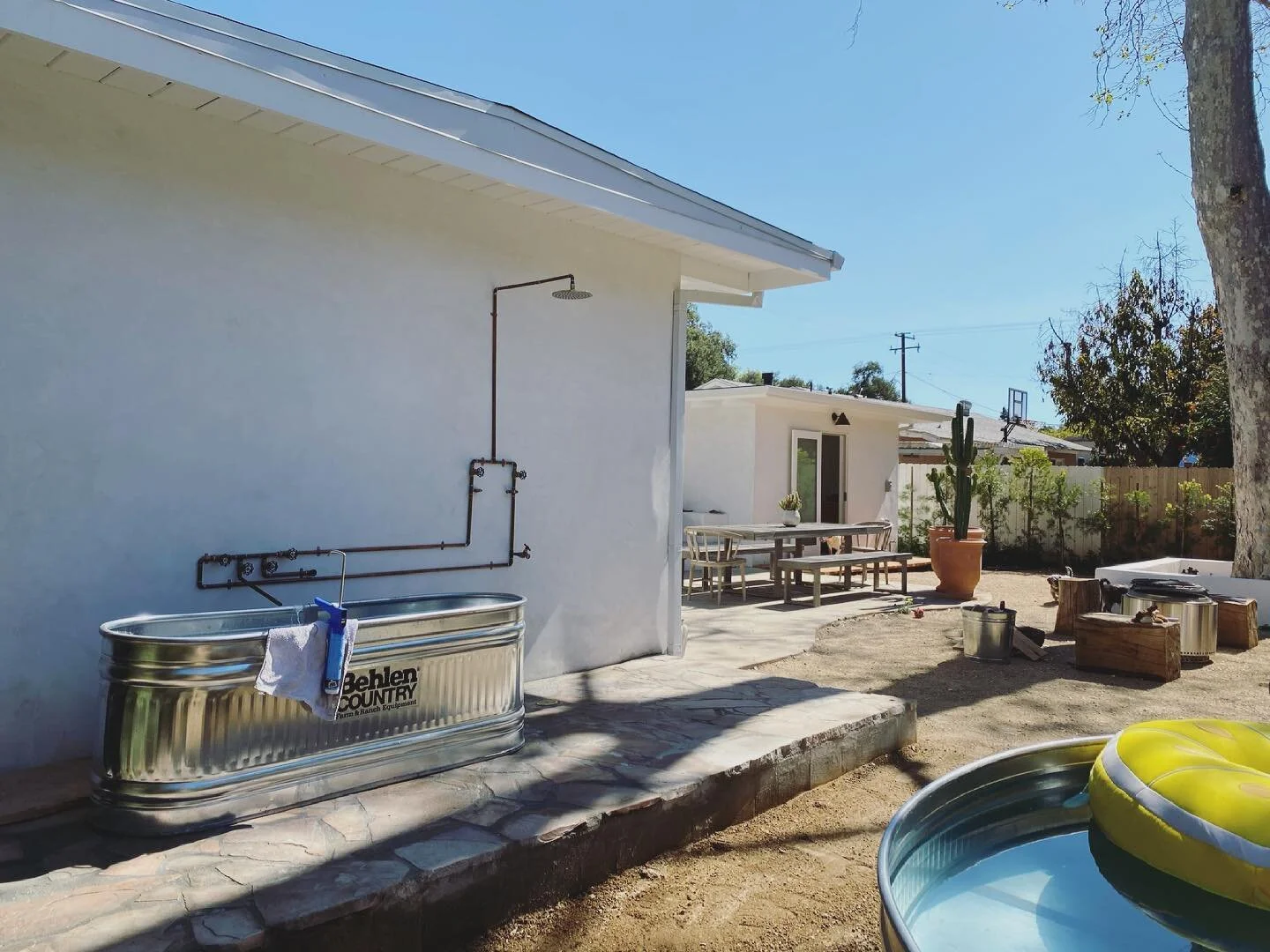 Outdoor bathing heaven almost done!! Powder coated frame for privacy shades and grout up next. A little stucco on the outside ledge and ready to soak.