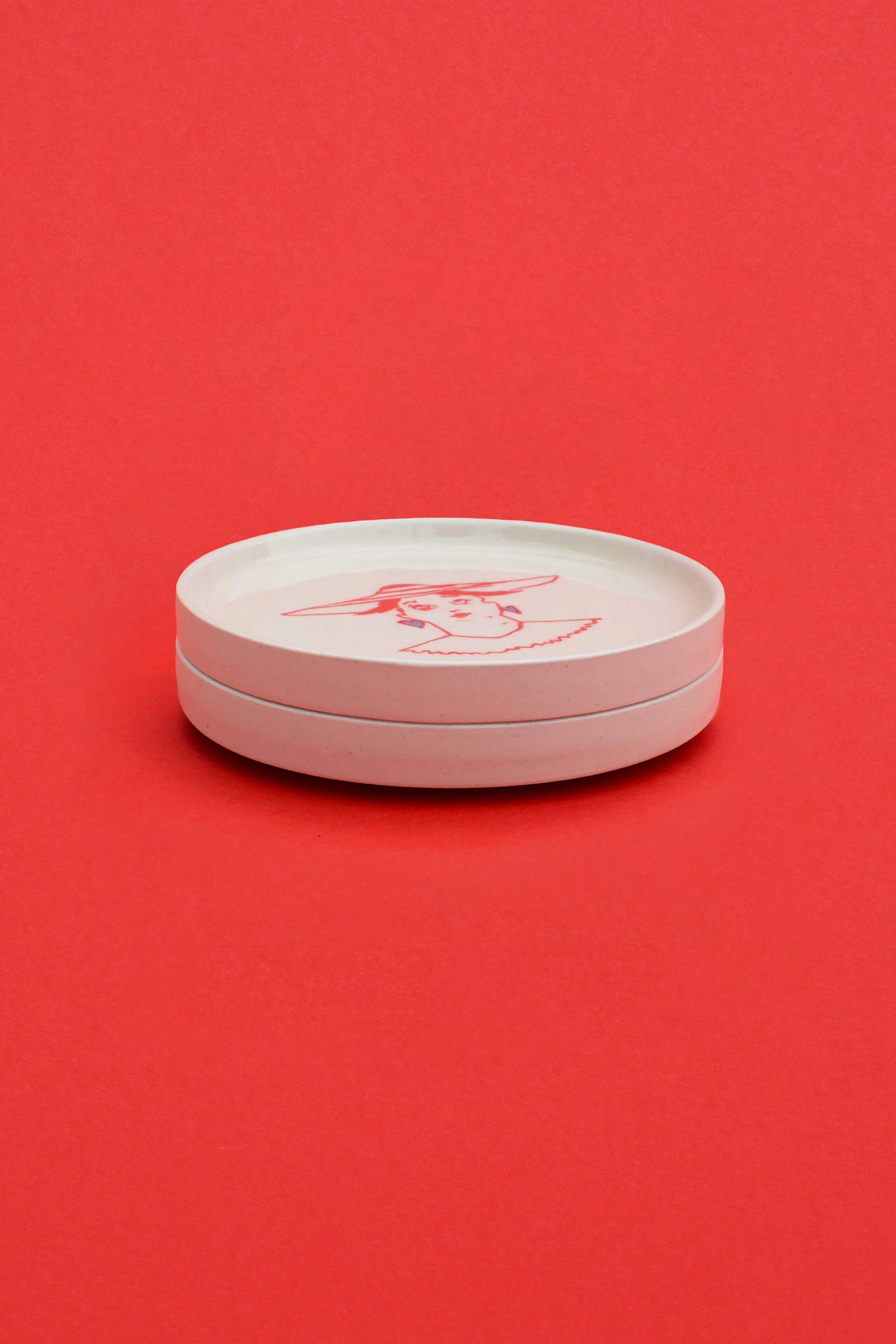 Clip Clop stoneware ceramic coaster set stack by artist, Isobel Hill. Two coasters are stacked upon one another.