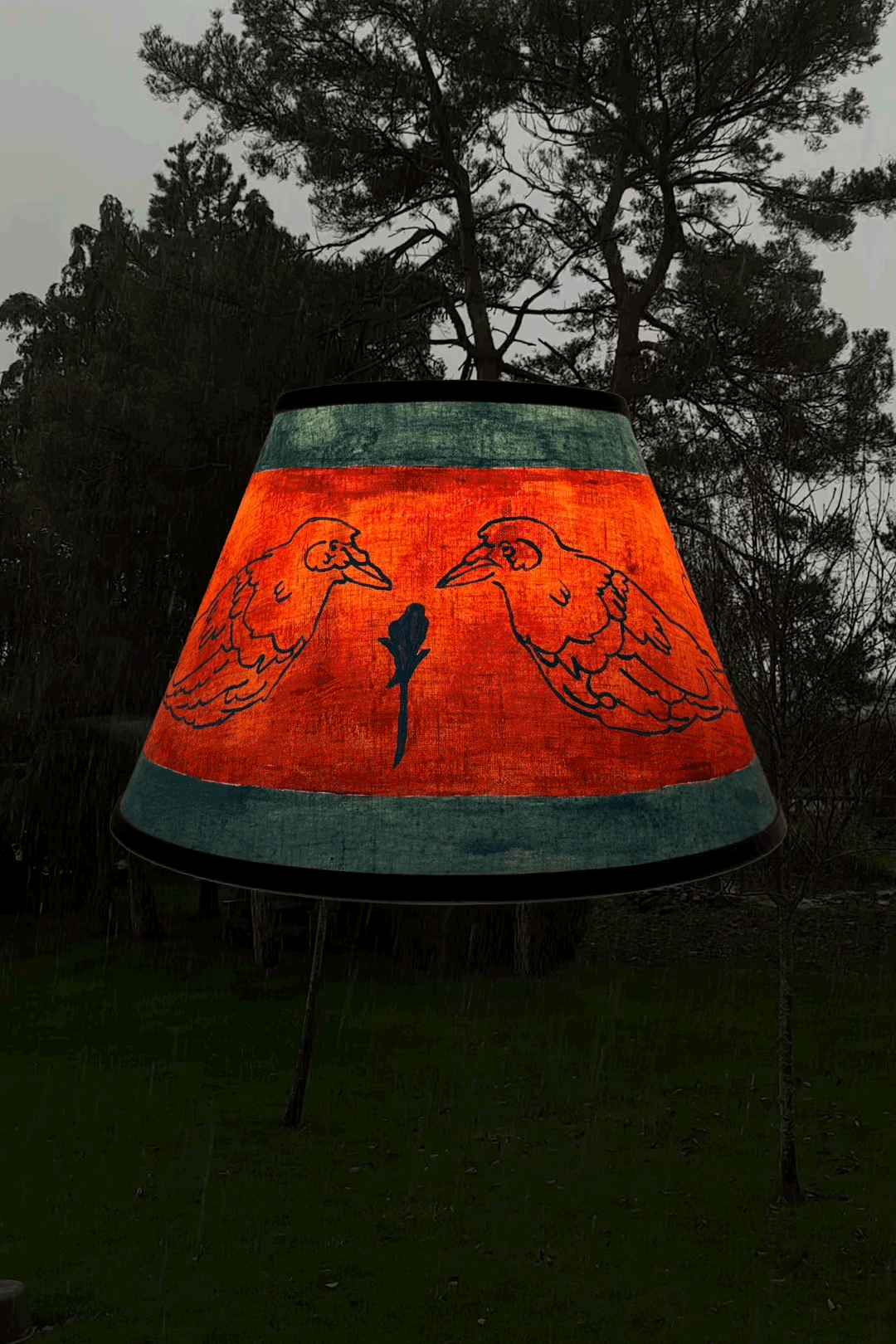 Crow linen lampshade by artist, Isobel Hill. Lamp is rotating whilst glowing, snow falls in the background.