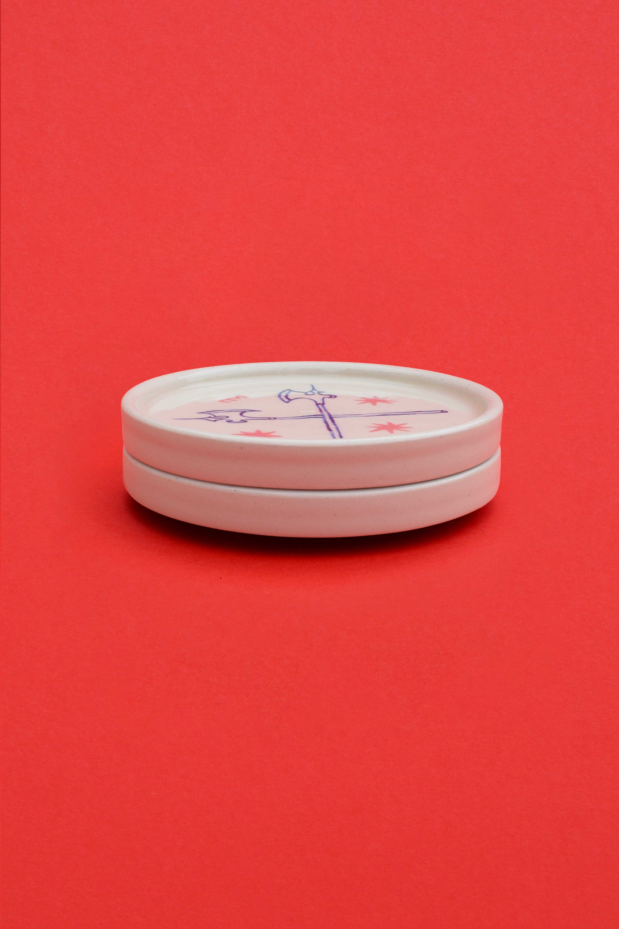 Valiant stoneware ceramic coaster set stack by artist, Isobel Hill. Two coasters are stacked upon one another.