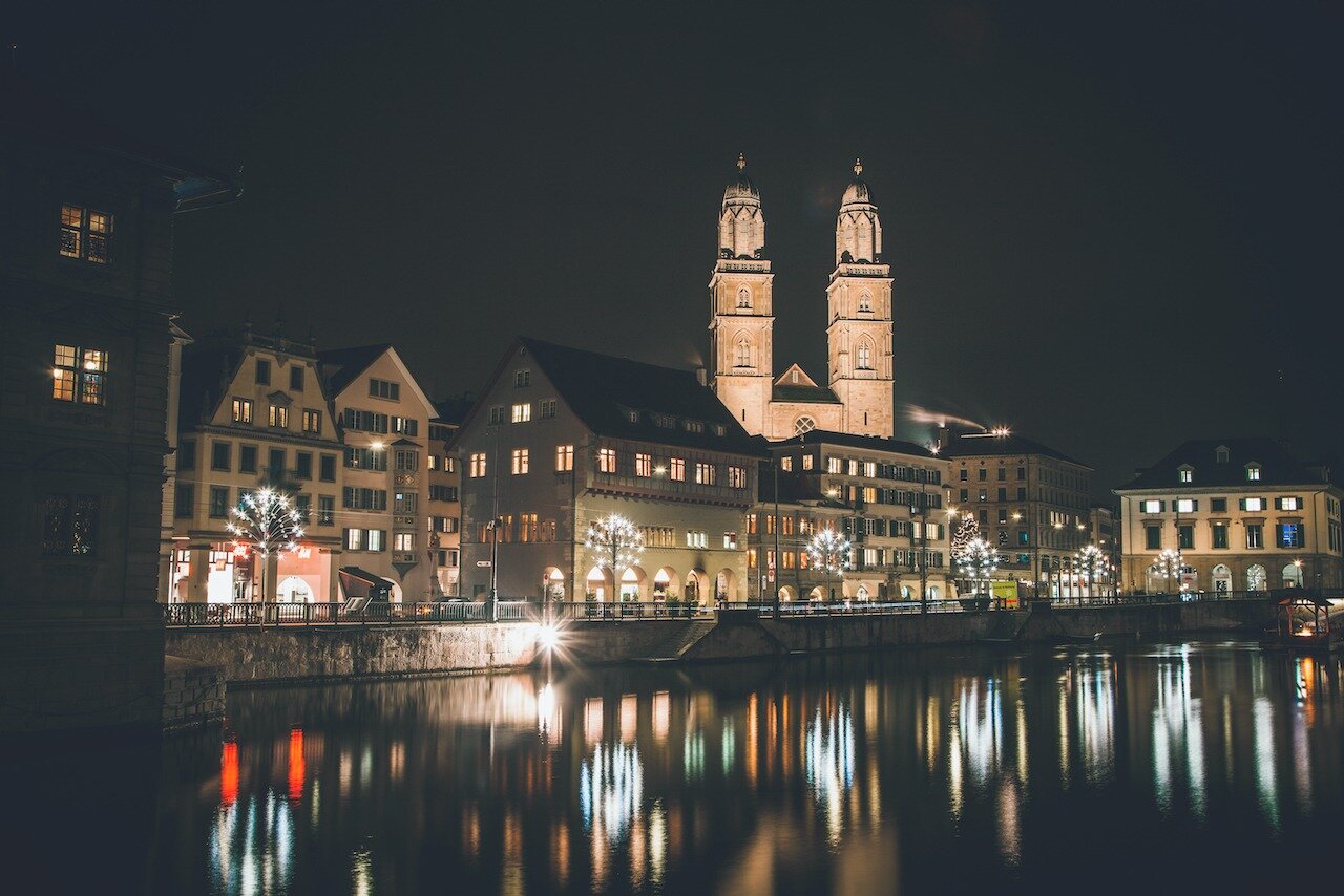 📍 Zurich, Switzerland

This is the Grossm&uuml;nster Church, nestled across the Limmat River in Z&uuml;rich, Switzerland. The weather the entire weekend was cloudy so any photos of the city by day proved to be disappointing. Luckily, the city at nig