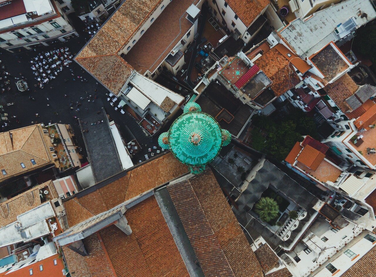 📍 Amalfi, Amalfi Coast, Italy

This is a top down view of the Cathedral in the town of Amalfi, the Duomo di Amalfi. I just love how the emerald green roof sits in such stark contrast with the rest of the brown and orange roofs that make up the town.