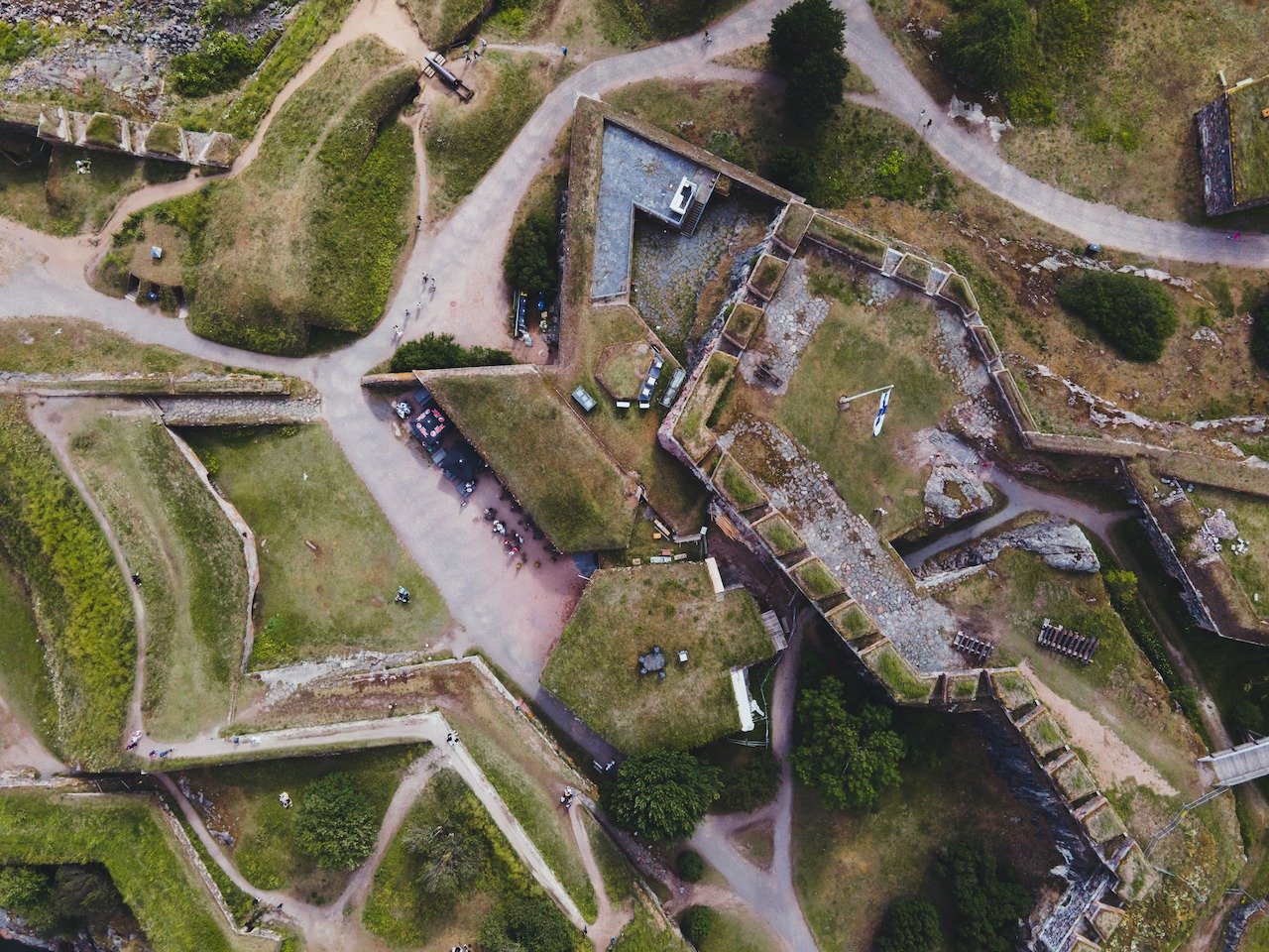 📍 Suomenlinna, Helsinki, Finland

A top down view of a fortification on the fortress island of Suomenlinna. You can take a cheap and short ferry ride to this set of islands, go to the grocery store near the ferry stop, pick up some food, and have yo