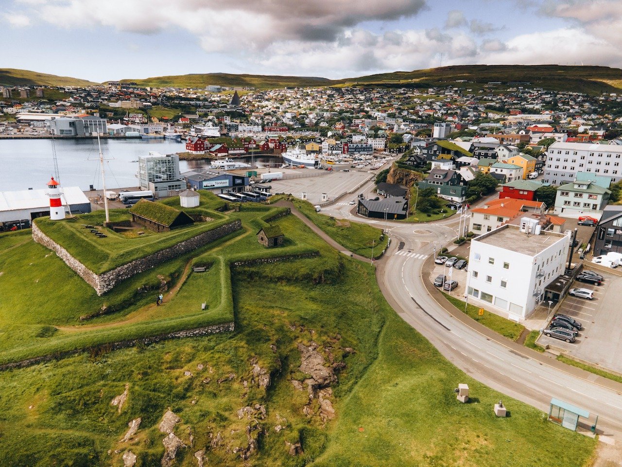 📍 T&oacute;rshavn, Faroe Islands

Such an awesome capital city in the Faroe Islands. In the middle of this harbor, where the turfed buildings are, is actually the home of the Faroese Parliament. The city is home to most of the Faroese residents but 