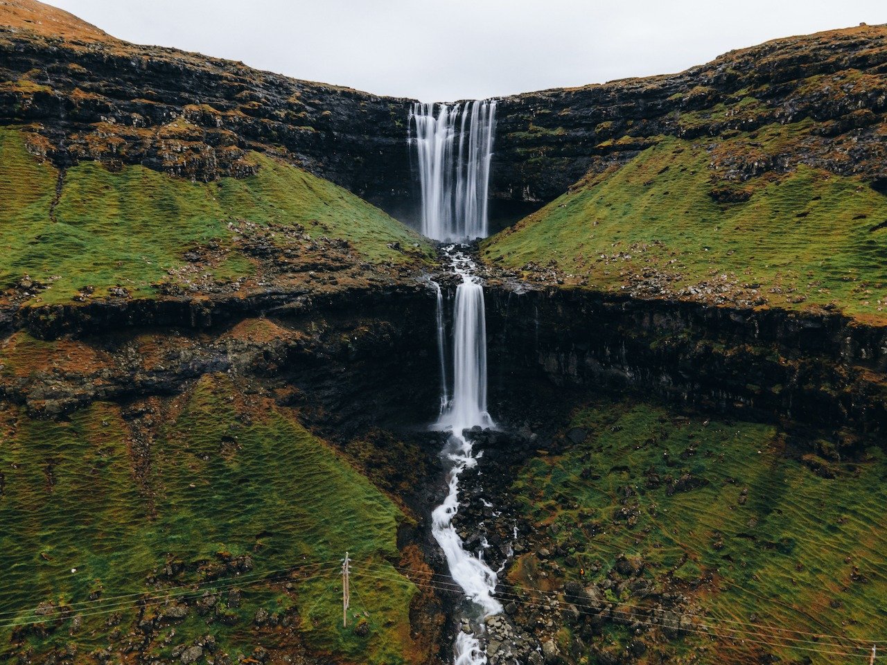 📍Foss&aacute; Waterfall, Streymoy, Faroe Islands

The tallest and most grand waterfall in the Faroe Islands, has to be the Foss&aacute; waterfall on the island of Streymoy. It features two large cascading drops at a total height of 140 meters. You c