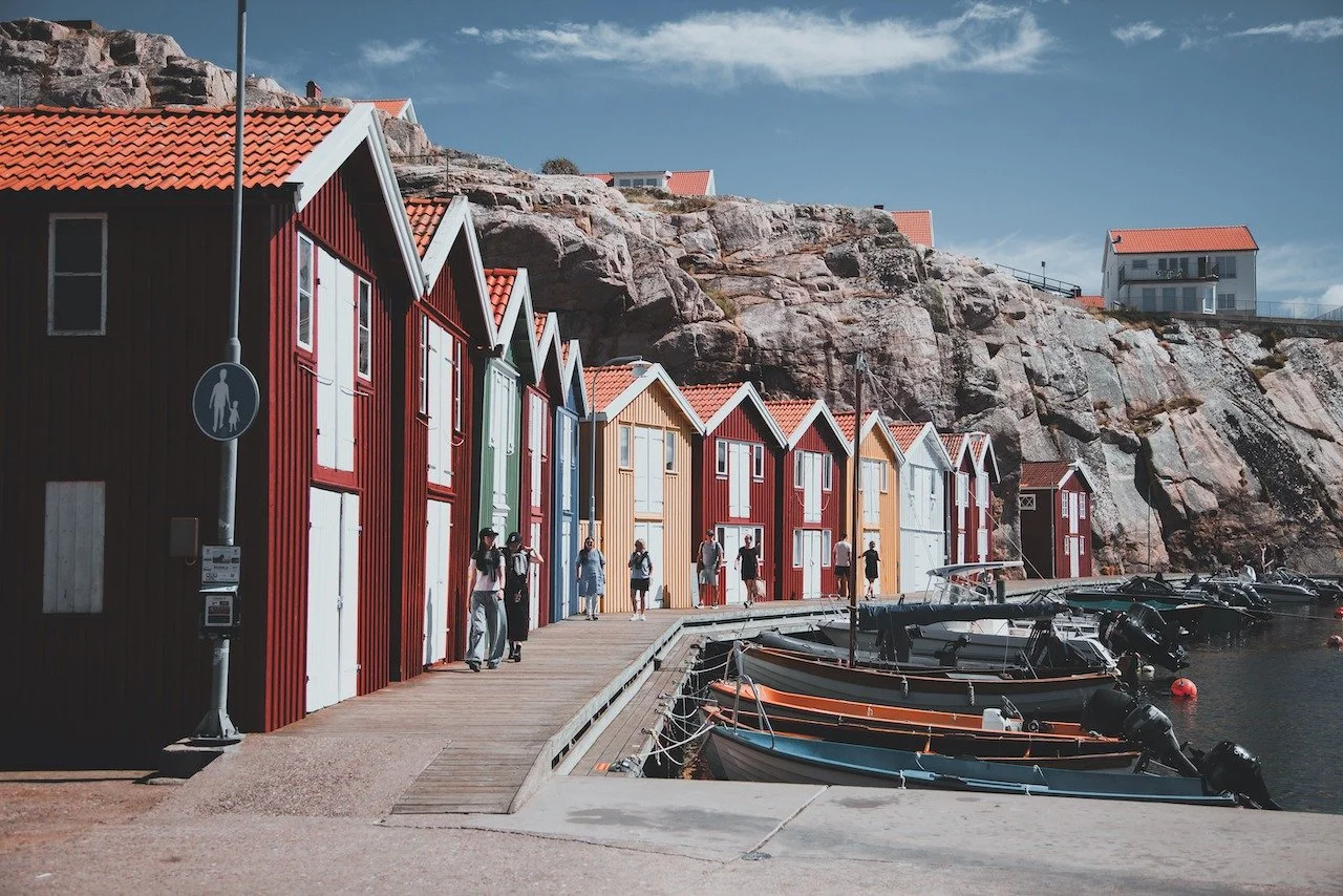 Bright boathouses, smooth granite, and the slow rhythm of the west coast. Sm&ouml;gen grew from a small fishing community during the great herring periods of the 18th and 19th centuries, when the sea defined everyday life. Today, fishing heritage mee