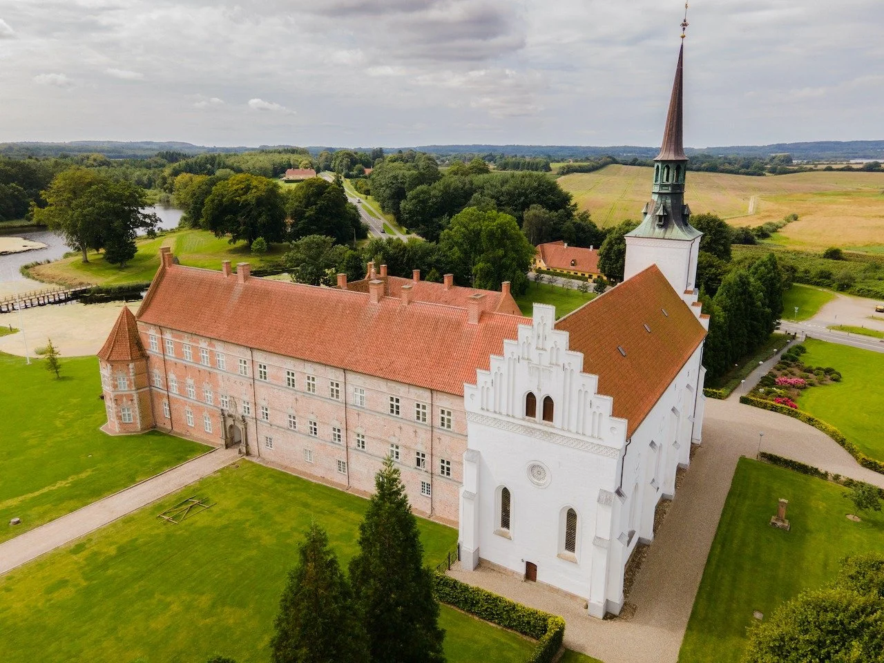 Brahetrolleborg Castle feels quietly timeless, surrounded by rolling fields, forests, and reflective lakes.
From above, its symmetry and isolation highlight how deeply this estate is woven into the Danish countryside. A place where history blends sea