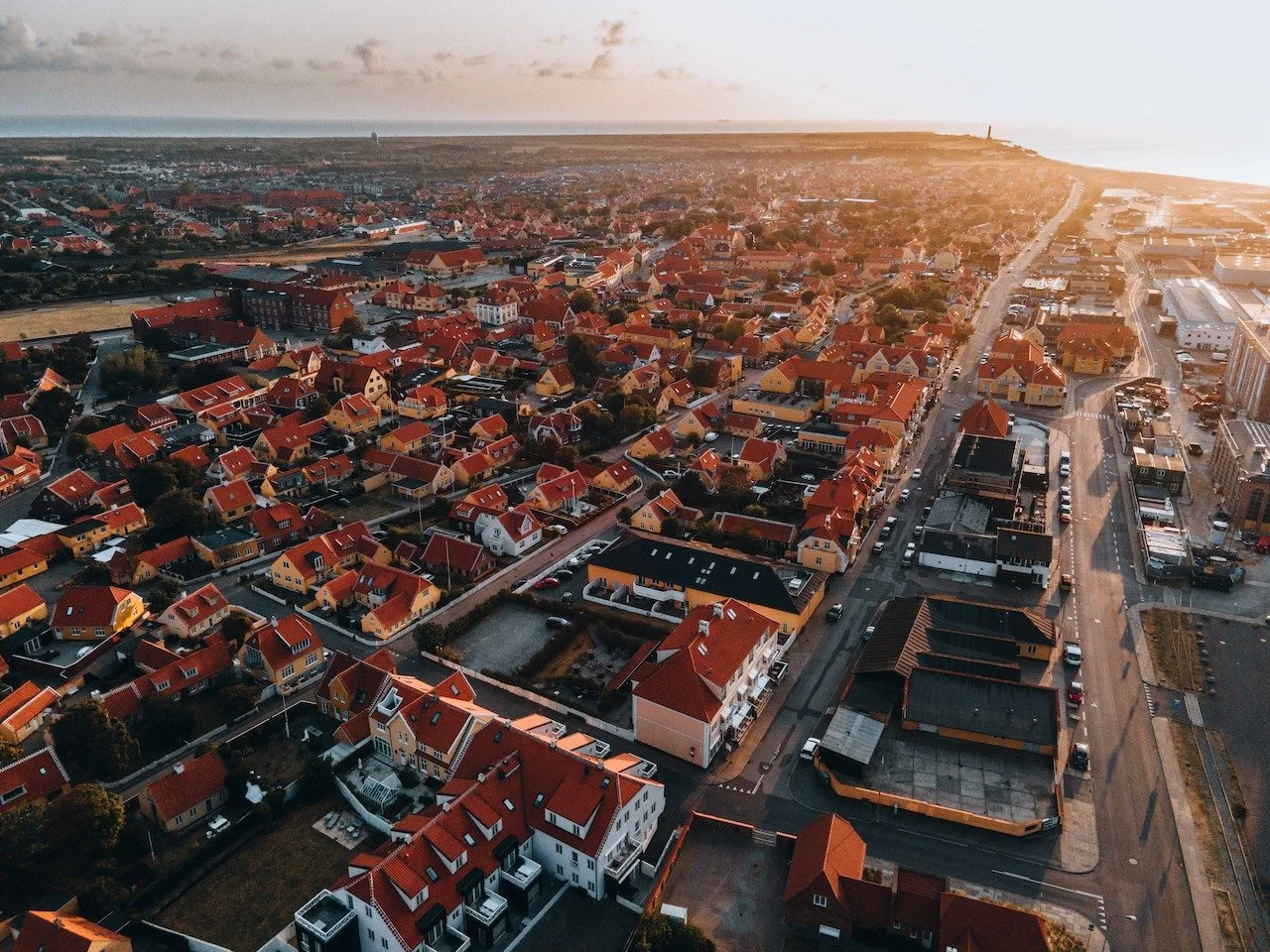 Sunrise over Skagen, Denmark
First light spilling over red rooftops and the endless sea beyond. Skagen has long drawn artists, sailors, and travelers to this meeting point of light and water, where mornings feel especially quiet. From the air, the to