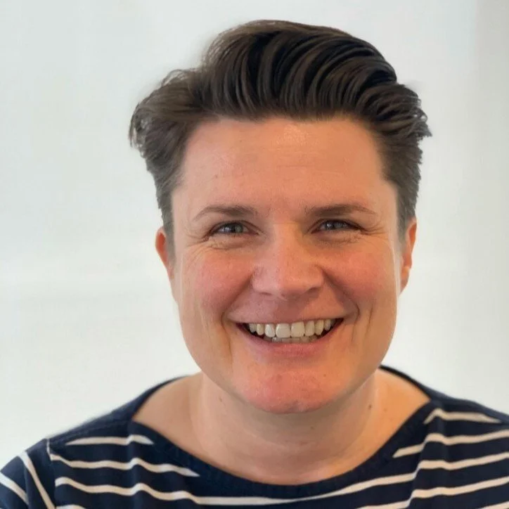 Helen Lawson is a white person with short brown hair. Helen is smiling warmly at the camera.