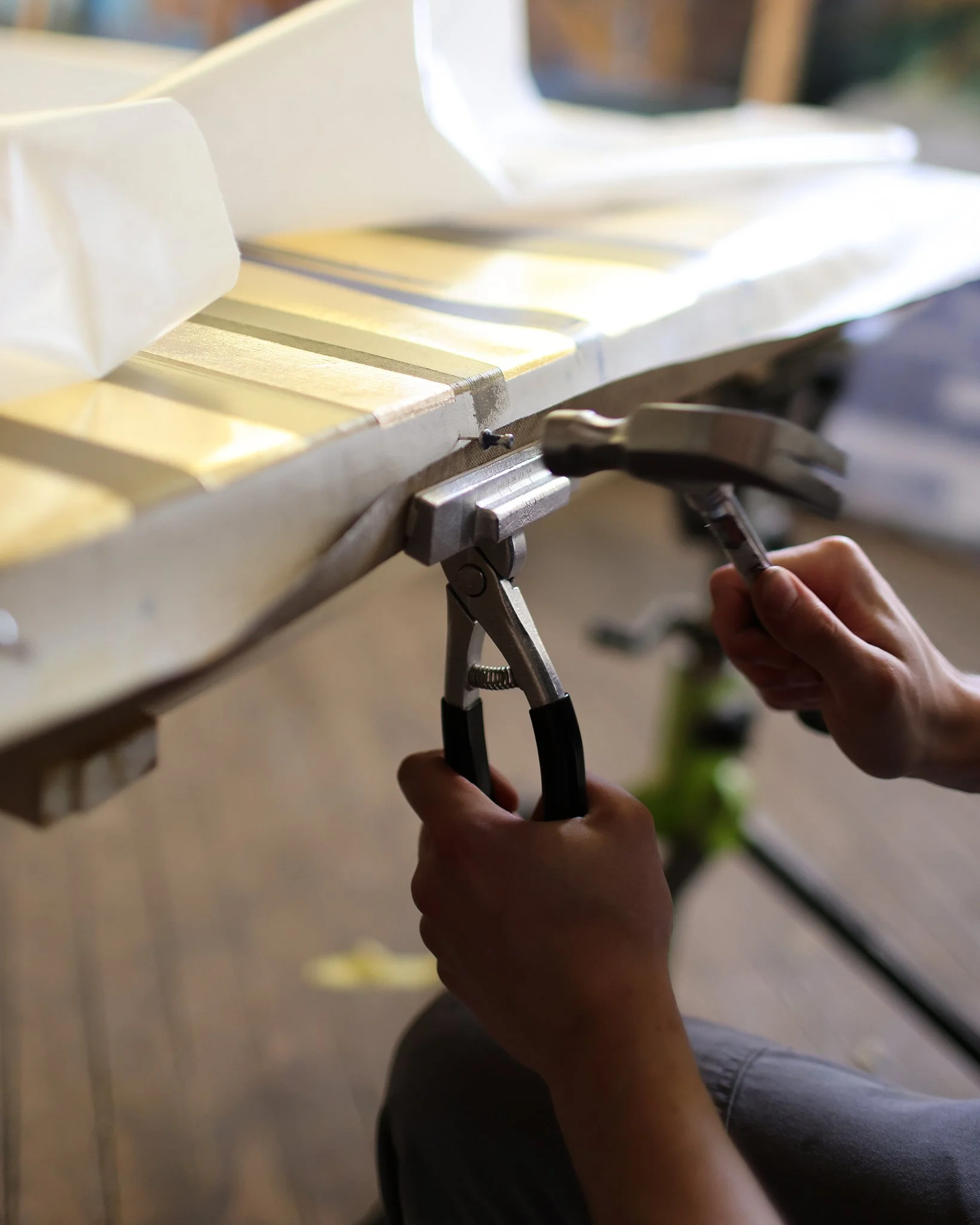 Fig House Studios stretching paintings with gold leaf, photographed by James Prochnik