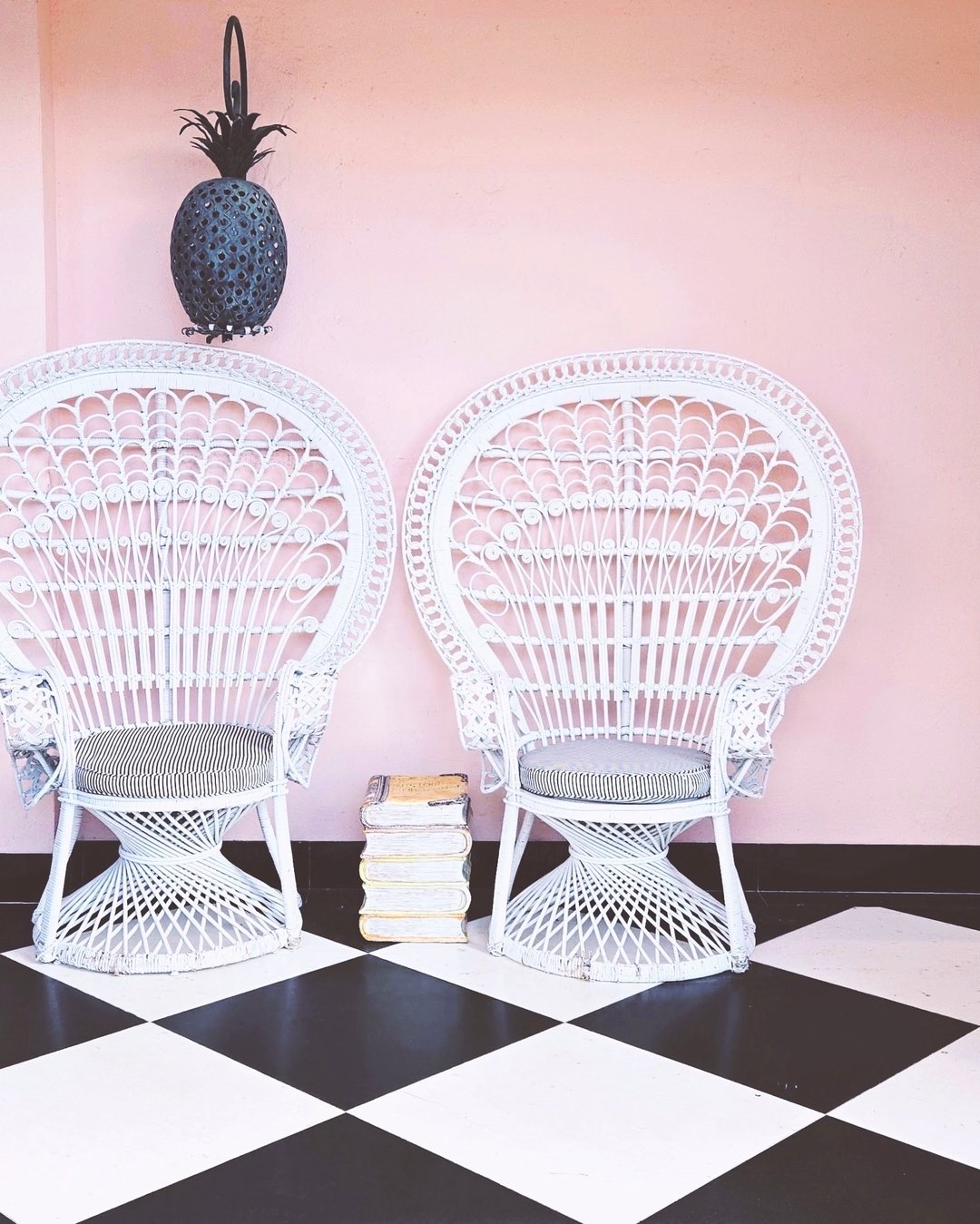 Sitting Pretty on a Saturday Morning🩷🤍🖤

Love, love this composition of the graphic, classic black &amp; white tile floor, the whimsical Victorian wicker chairs, a delicious pineapple lantern🍍&amp; walls that make me blush. Art Deco &amp; Gilded 