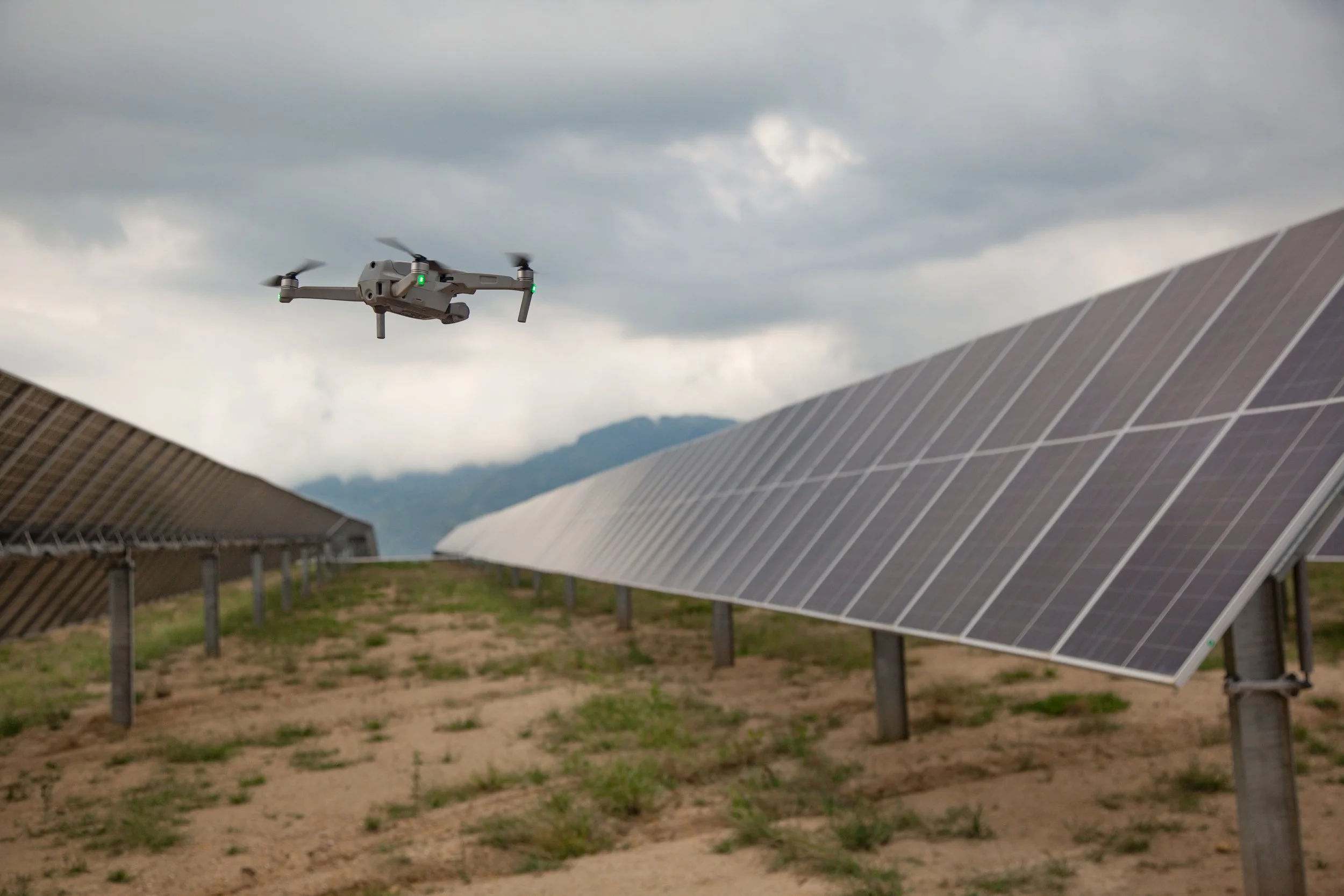 drone-next-to-solar-panels-during-inspection