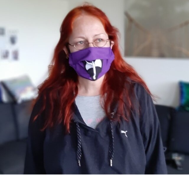 woman-red-hair-labrys-mask-dyke-march-2020