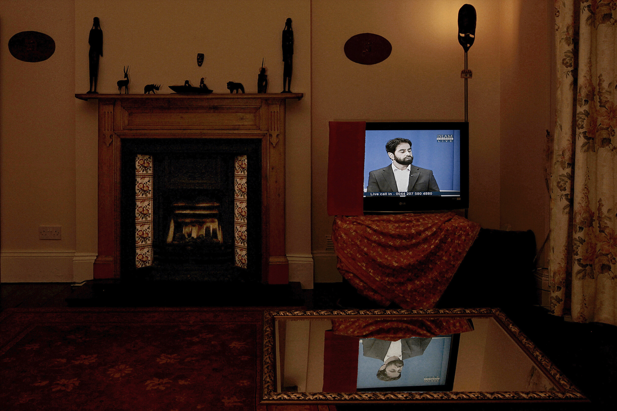   UK. London. 2012. Azad Ali presents his show ‘Your Views on the News’ on Islam Channel. In 2009, Ali was suspended from his job as a Treasury civil servant after a newspaper reported that Ali, on his blog, had advocated the killing of British soldi