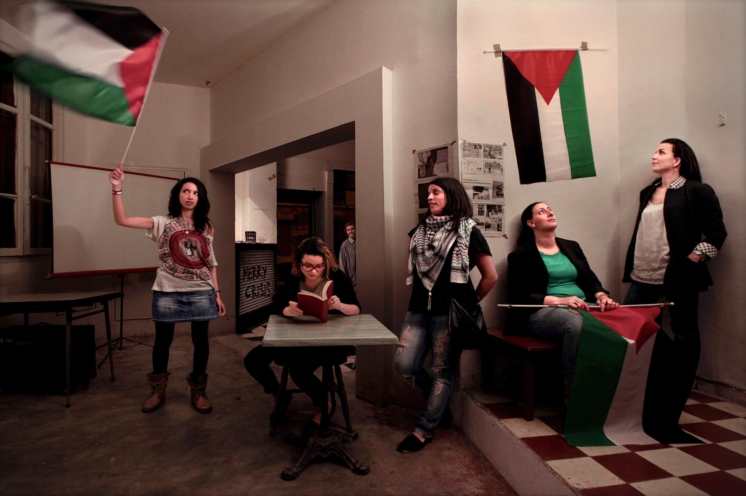   France. Marseille. 2014. Inside a café – cum – library young members of EuroPalestine, a pro-Palestine association, rehearse their acts and speeches a night before organizing a protest theater against Israel in downtown Marseille  