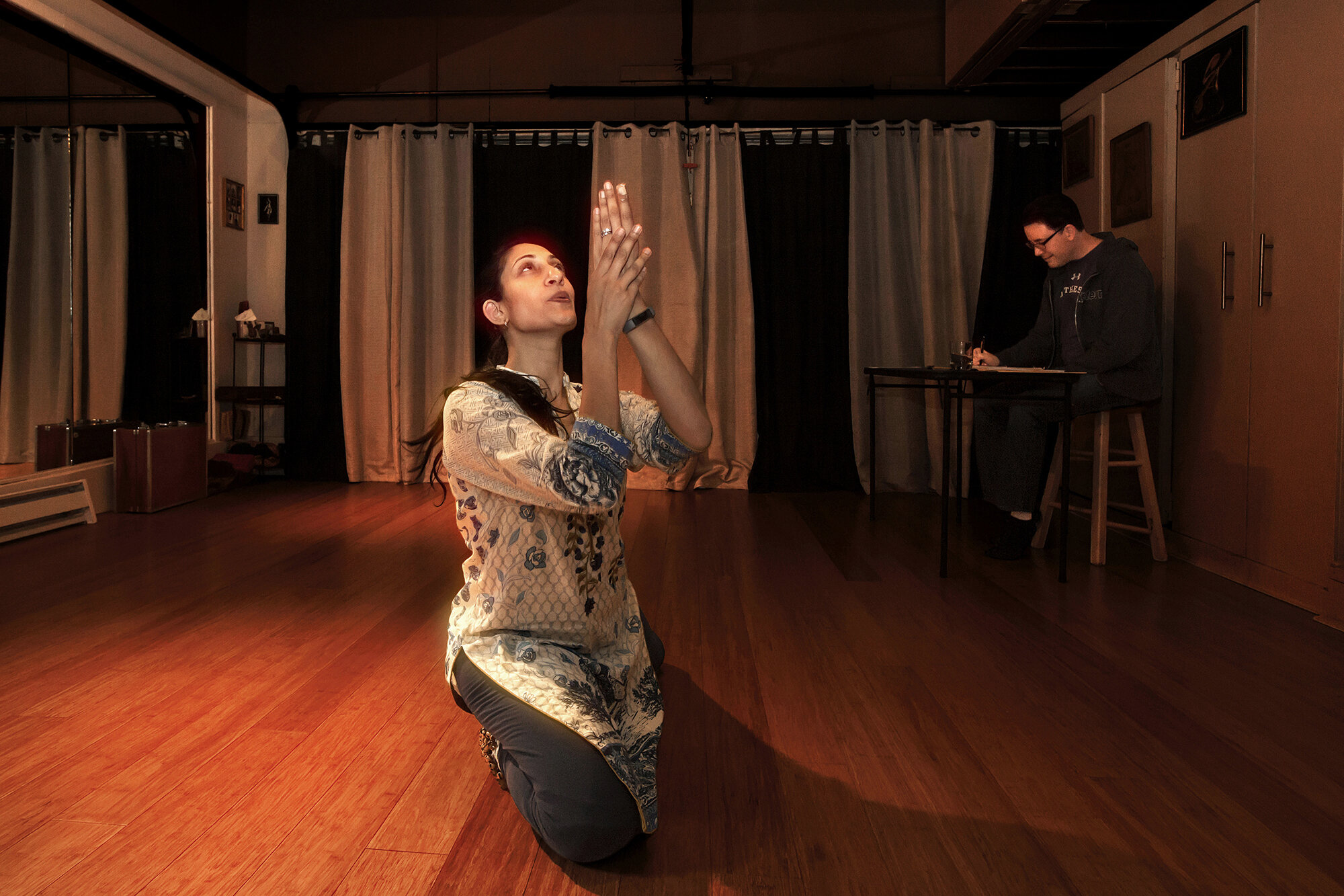   USA. Menlo Park, California. April, 2018. Farah Yasmeen Shaikh (left), a Kathak dancer, rehearses a dance drama in her studio as Dr. Mathew Spangler (right), the playwright and director of the drama, takes notes. Farah's dance drama, The Forgotten 