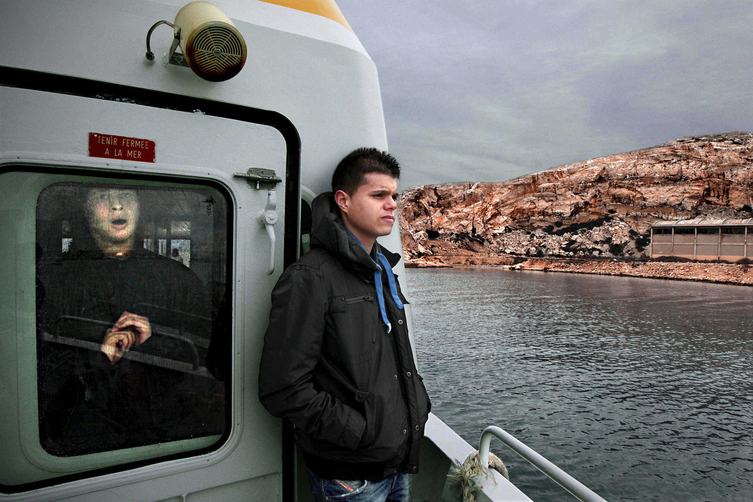   France. Marseille. 2013. Omar Farhoune [right], 17, travels to Frioul Islands, a tourist destination located approximately 4 km from Marseille. Omar arrived in Marseille in early 2013 from Barcelona, Spain, with his father. Due to the economic cris
