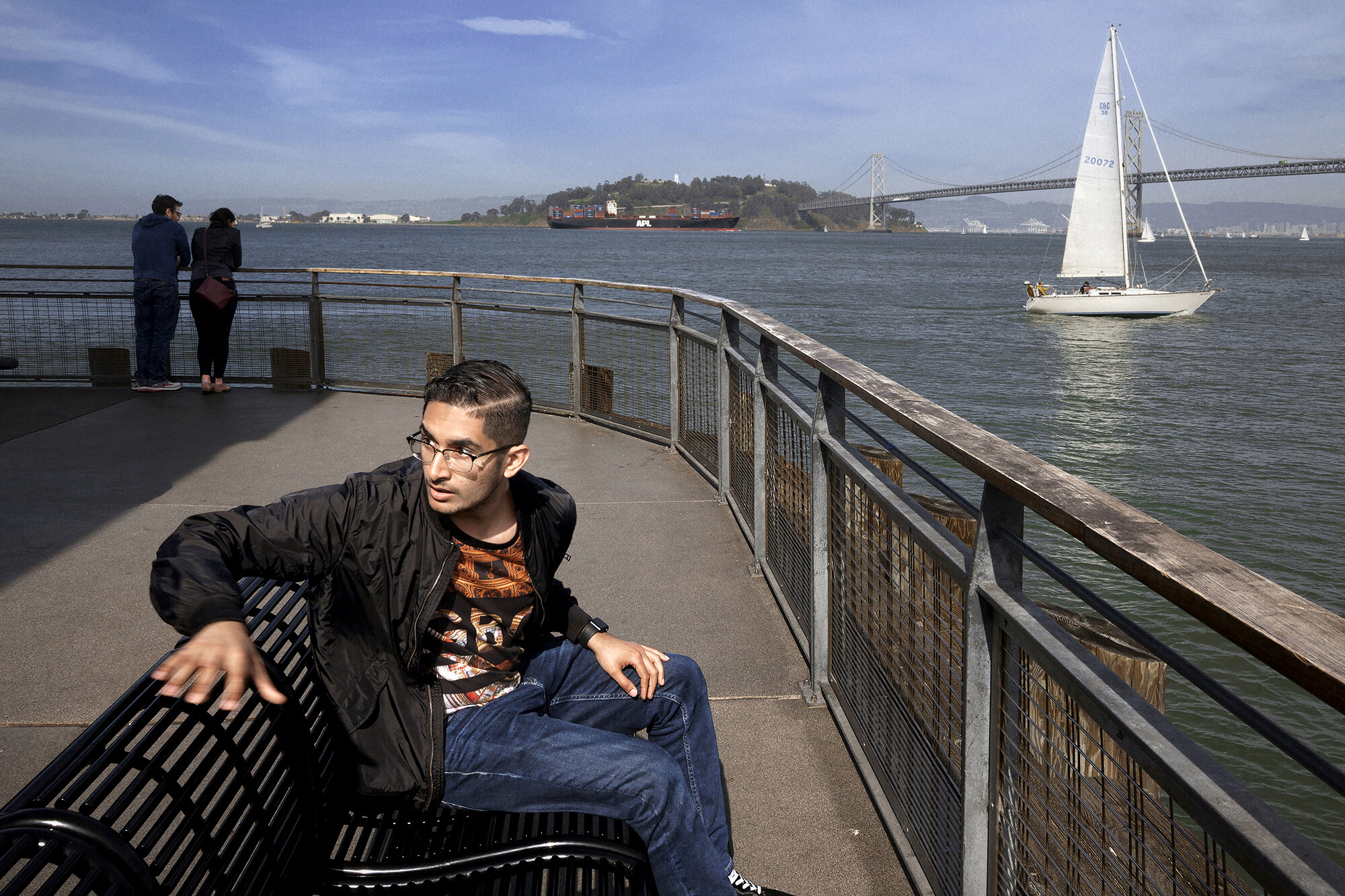   USA. San Francisco, California. 2018. Basil Rizwan, 19, at Pier 1, The Embarcadero, during a visit with friends to the tourist hotspots of San Francisco.        