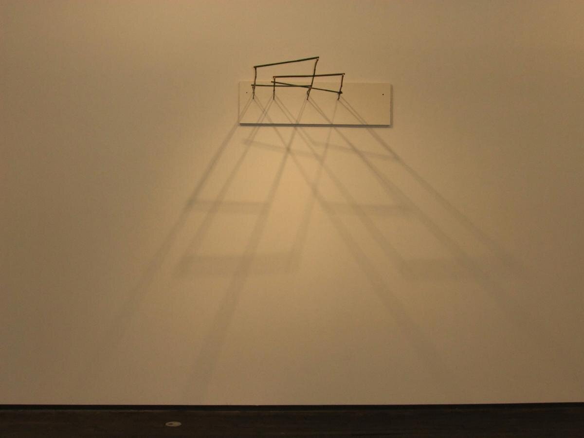  View of Al Taylor,  Real Real , (1995), Bamboo garden stakes and wire mounted on Formica laminate, 11 x 44 x 40 inches - Courtesy of David Zwirner, New York 