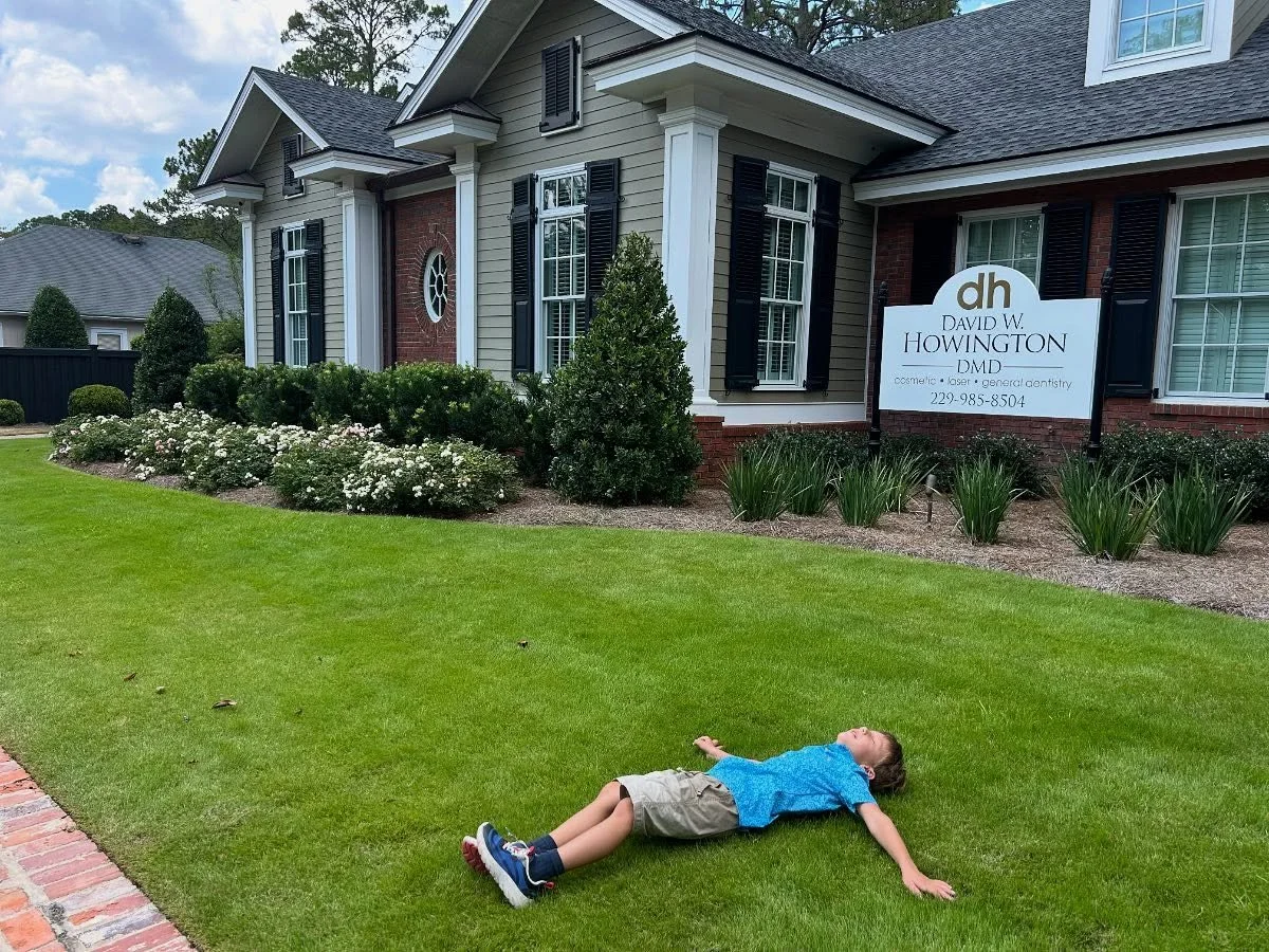 One of our favorite maintenance accounts! Sonny decided the lush turf was the perfect nap spot after his dental appointment.