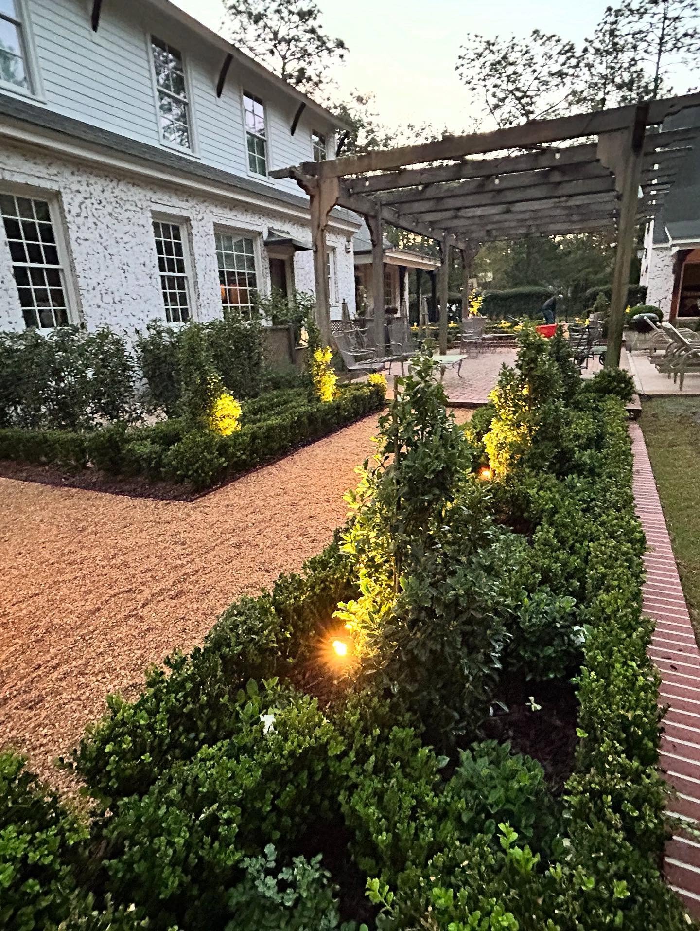 Our latest project completed is a multi-level parterre garden. Low brick walls allow for smooth grade changes and a terraced look. In another month multiple flowering plants will fill the inner knots with white and purple flowers.