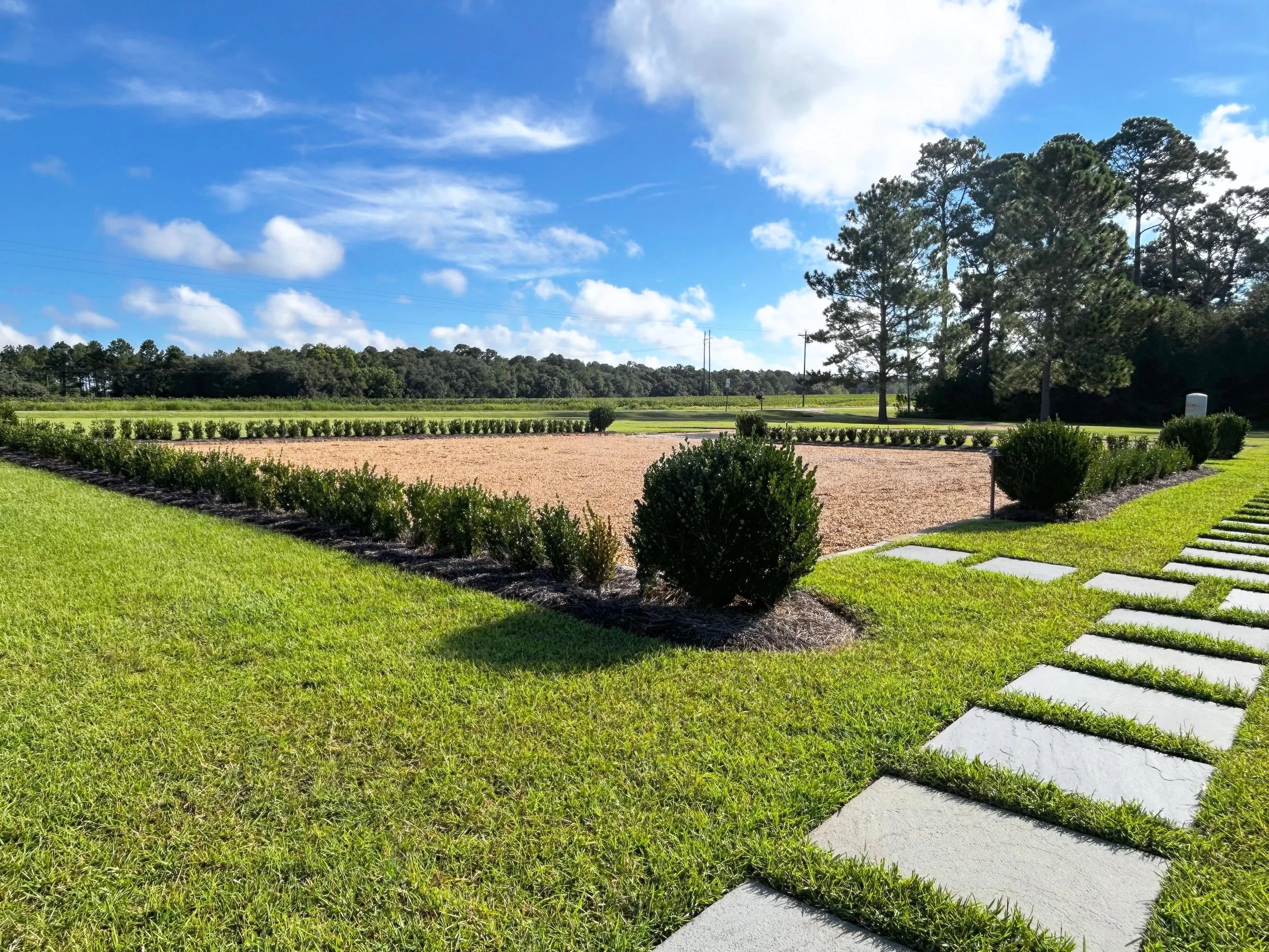 Plenty of room for guests, family or maybe a boat. A thoughtfully designed parking pad is an important element in our landscape design-build projects. We don&rsquo;t want our clients playing parking Tetris!