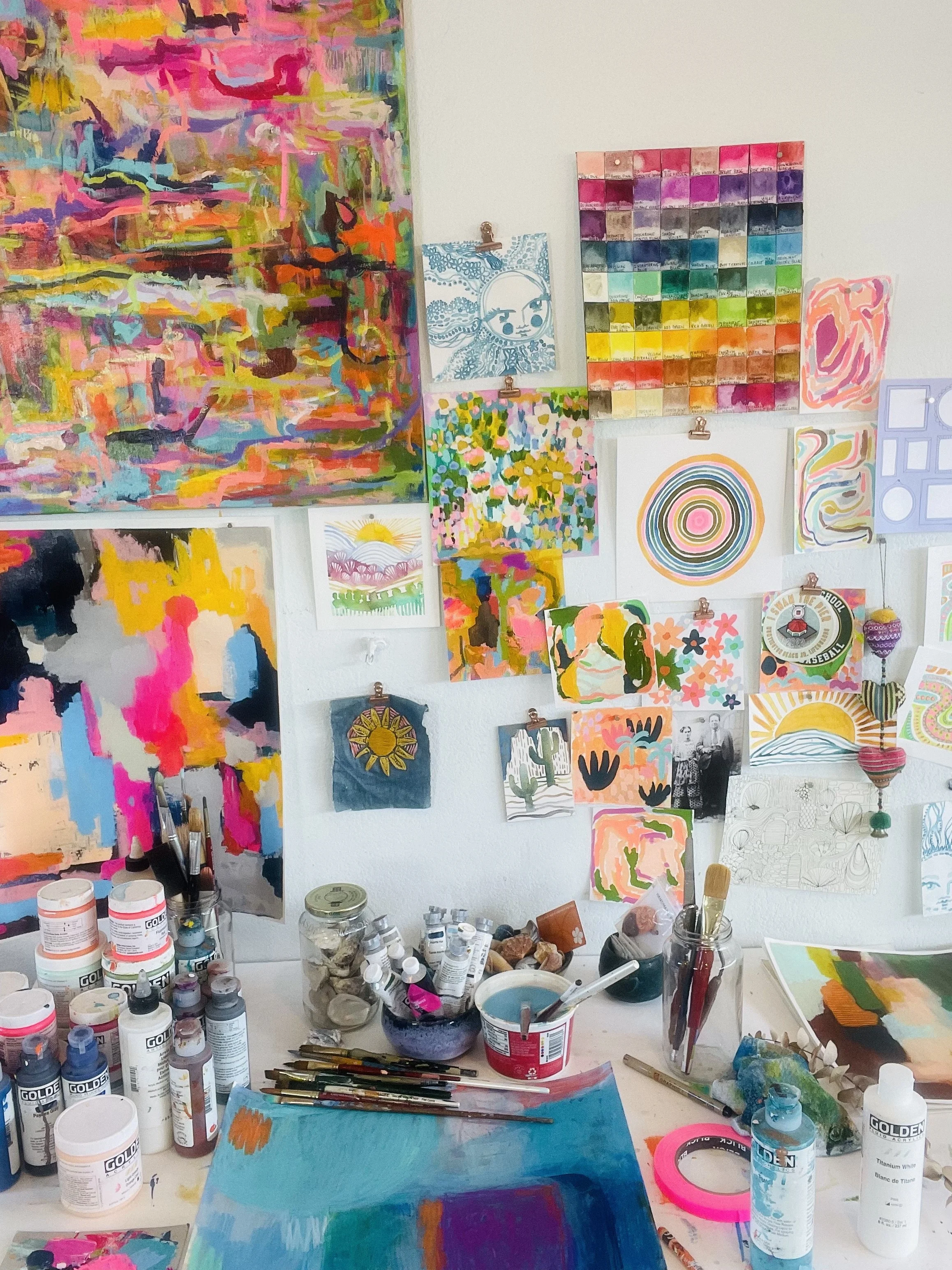 Sunny Altman working on a colorful watercolor painting in her Southern California art studio