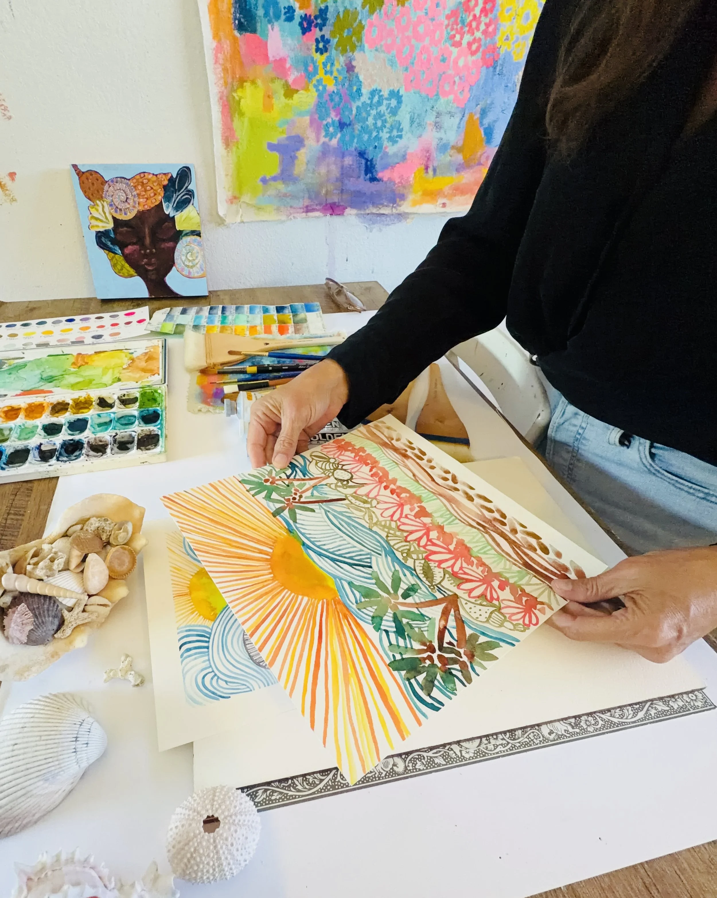 Sunny Altman creating a colorful painting in her Southern California art studio.